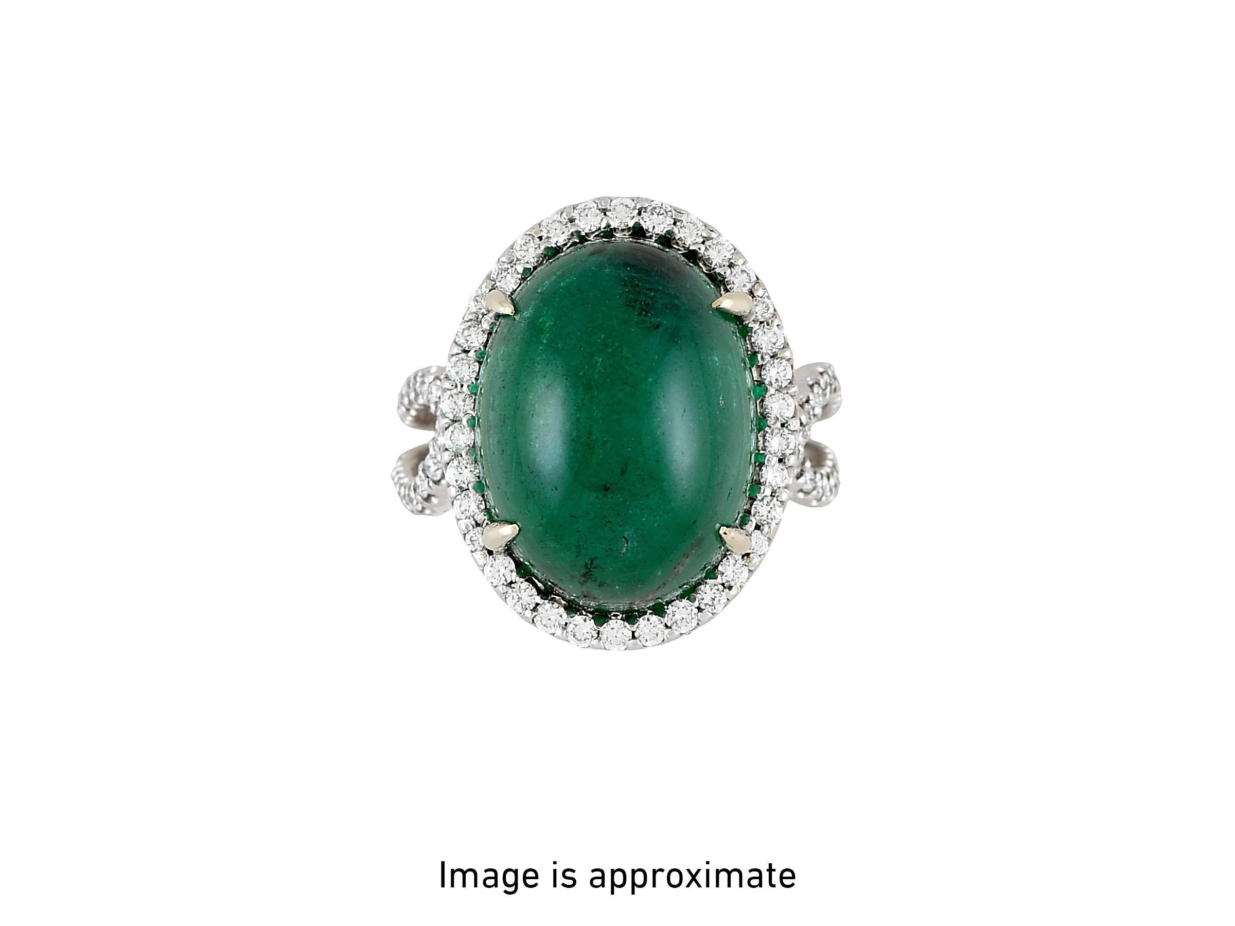 A mesmerizing 16.70-carat, cabochon Zambian Emerald is accented by numerous diamonds totaling 0.90 cts. Beautifully crafted in 18K White gold. GIA certified. 