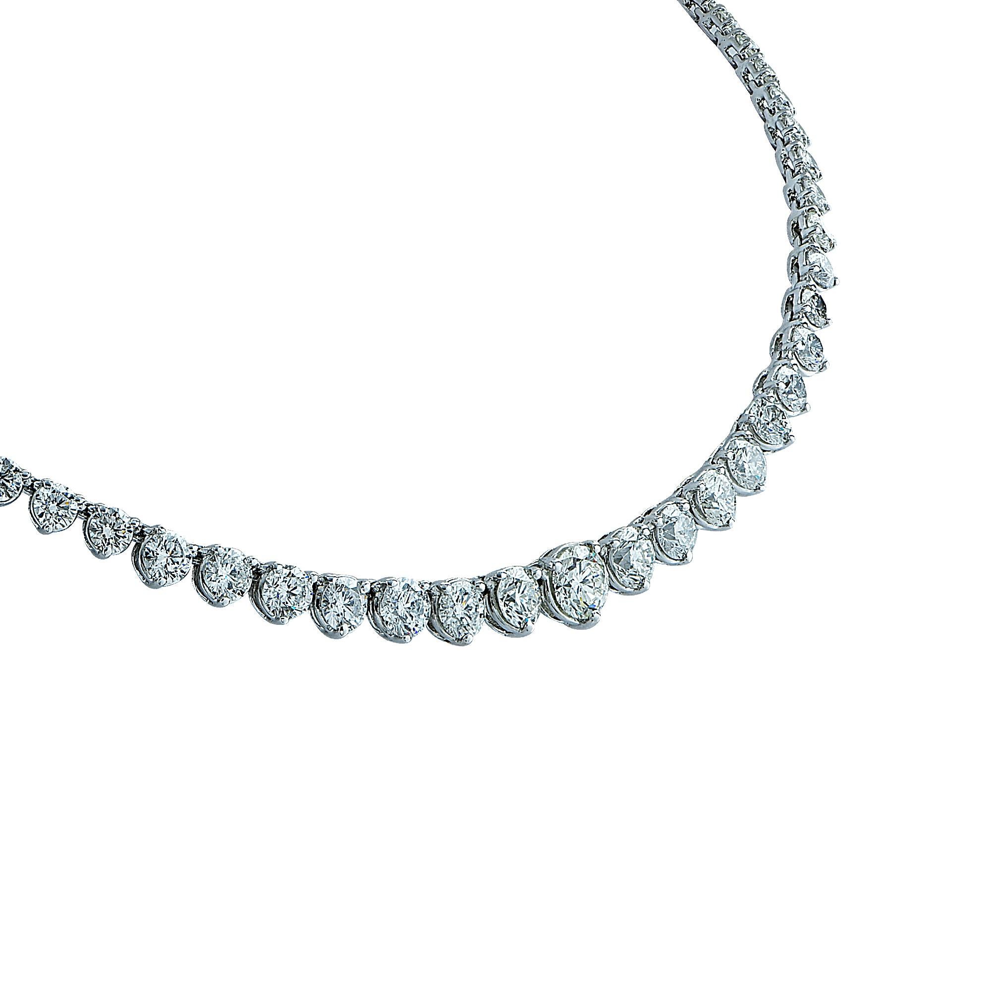 Platinum riviera necklace featuring approximately 16.70cts total of round brilliant cut diamonds G-H color SI1-2 clarity with a diamond clasp containing 4 marquise cut diamonds. The center diamond weighs approximately .92cts. This necklace measures