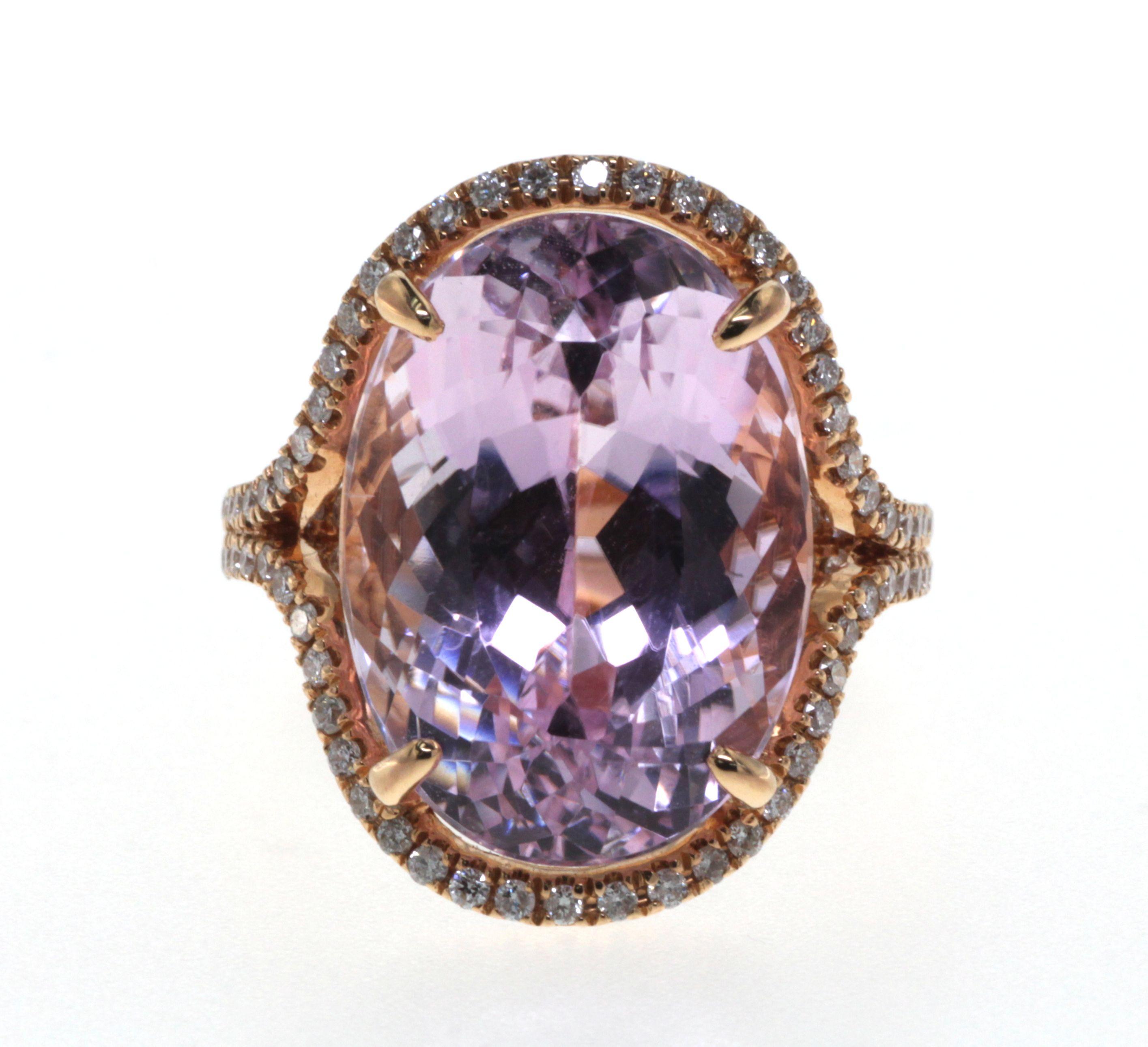 Radiating an aura of unparalleled luxury and elegance, this breathtaking cocktail ring is a celebration of the extraordinary. At its heart lies a spectacular 16.70-carat Kunzite, gleaming with a soft lilac hue, capturing the essence of a serene
