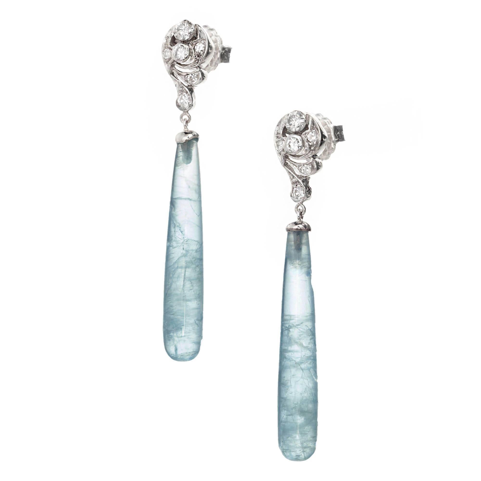 Vintage 1940s Art Deco tear drop cylinder natural aquamarine and dimaond dangle earrings in 14k white gold with bright sparkly diamonds and untreated aqua dangles

2 teardrop aquamarines light blue MI 32 x 59mm approximate 16.70 carats
12 round