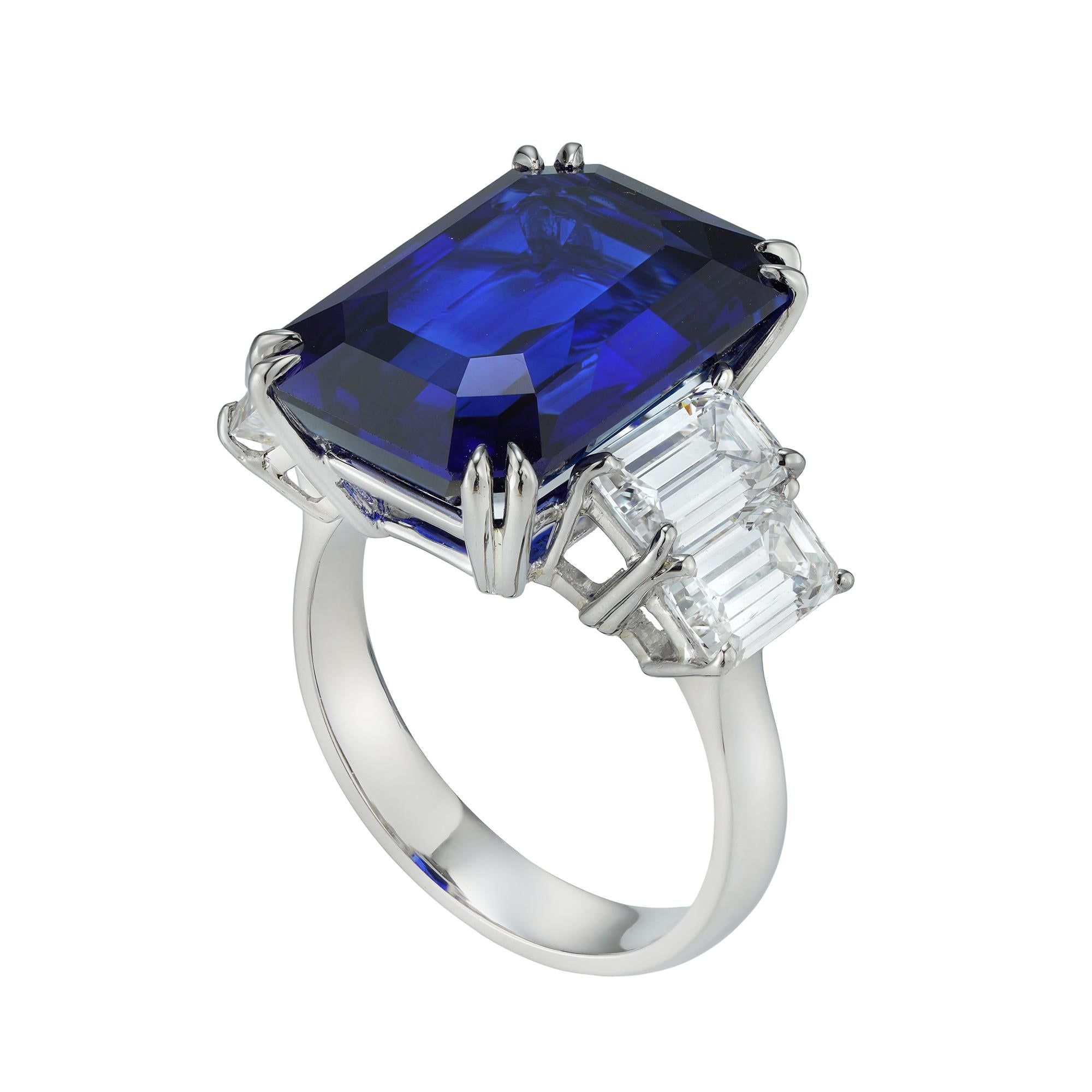 An important sapphire and diamond ring, the octagonal-cut sapphire weighing 16.73 carats accompanied by GCS Report stating to be of Sri Lankan origin, set between four emerald-cut diamonds weighing 3.24 carats in total, (0.86ct E VVS2, 0.81ct E VS1,