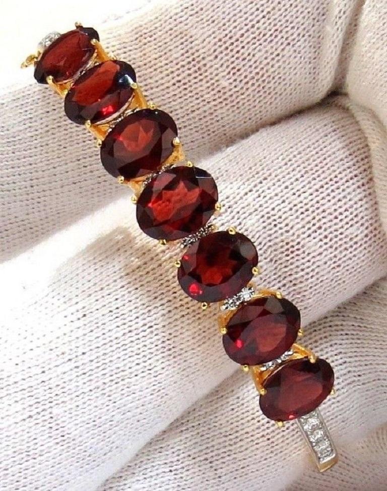 Classic Natural Red Garnet & Diamonds Bangle Bracelet  

Red Garnet: 16.00ct.

Average: 9.1 X 6.9mm

 Excellent & Vibrant colors.

Transparent & oval cuts.

Clean Clarity and very good cuts.

Strong Red Colors



.75ct. diamonds:

Rounds & full cuts