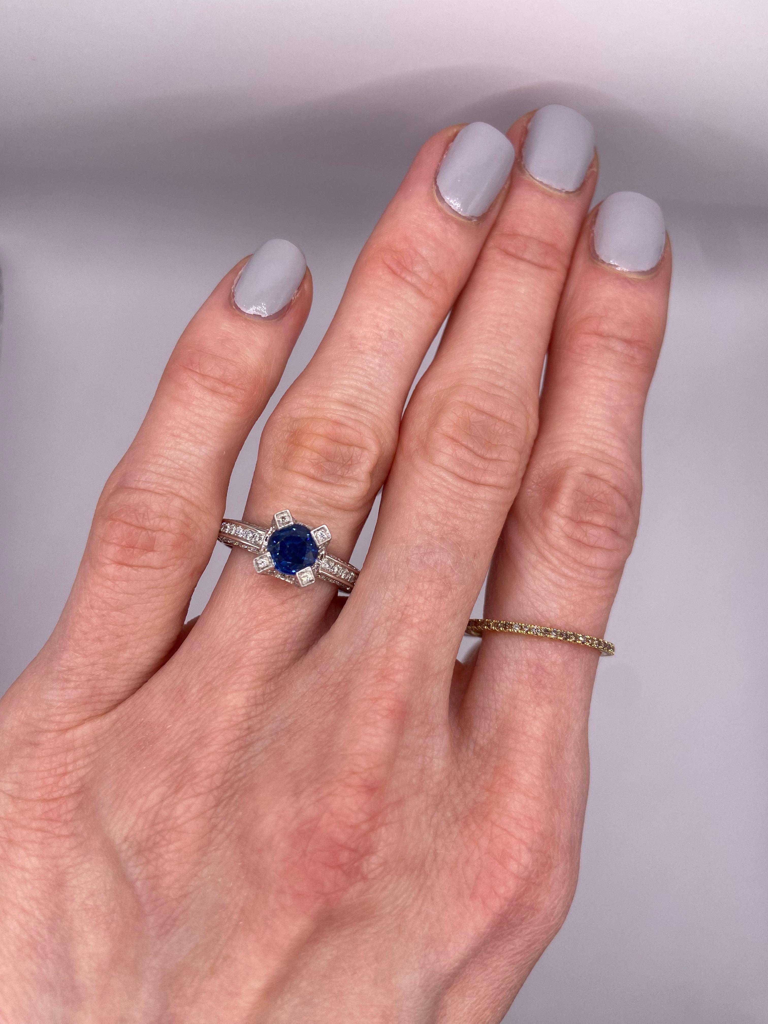 Metal: 14KT White Gold
Size: 6.75
(Ring is size 6.75, but is sizable upon request)

Number of Round Sapphires: 1
Carat Weight: 1.11ctw
Stone Size: 5.9mm

Number of Round Diamonds: 96
Carat Weight: 0.56ctw