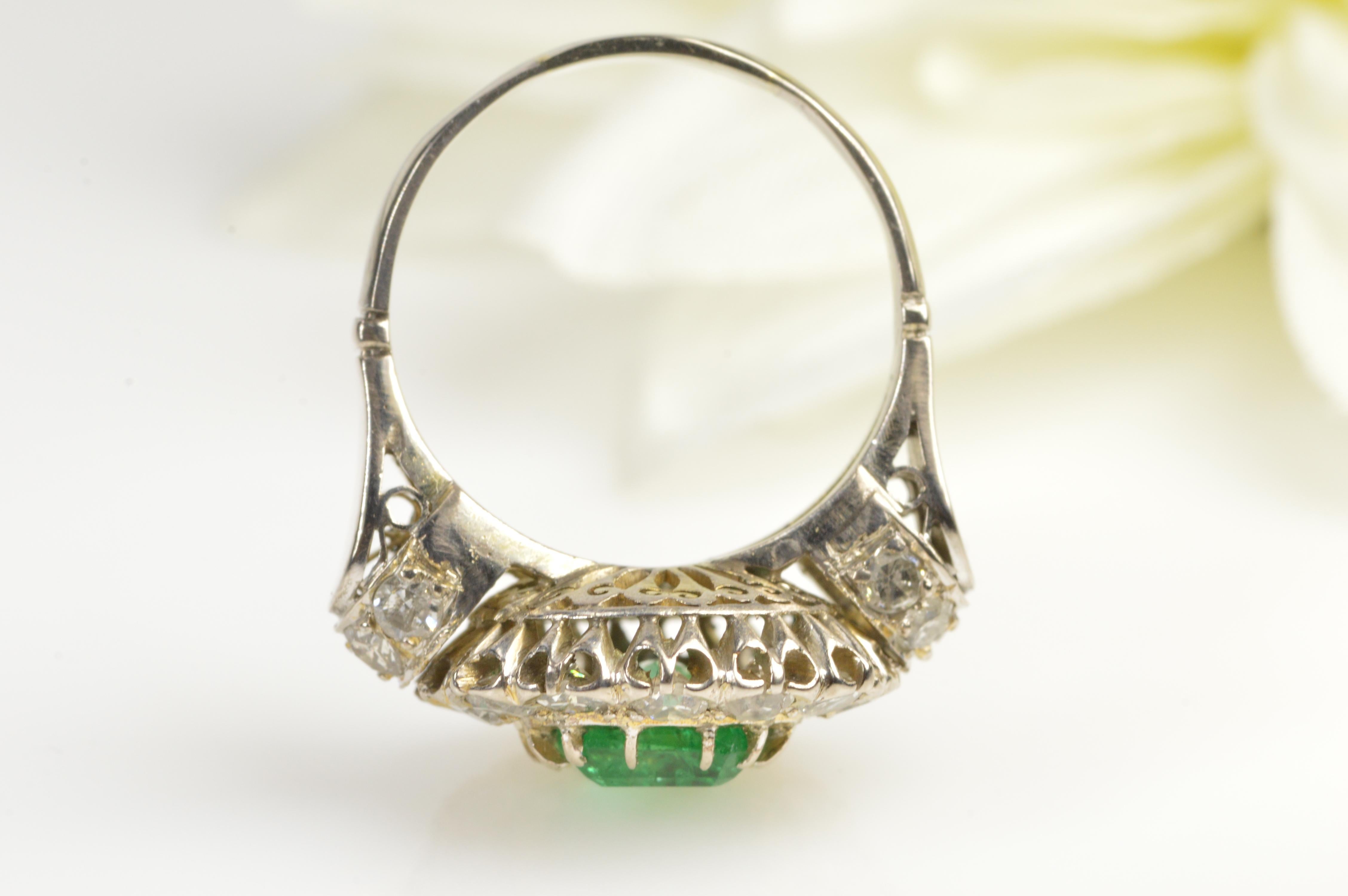 This beautiful handcrafted emerald and diamond ring was created is a fine example of the Victorian era’s style and allure. 
·Item: 18K Victorian 1.68 CT Emerald 1.32 CTW Mine Cut Diamond Ring - Size 6.75 / White Gold  
·Composition: 18k Gold 
·Gem