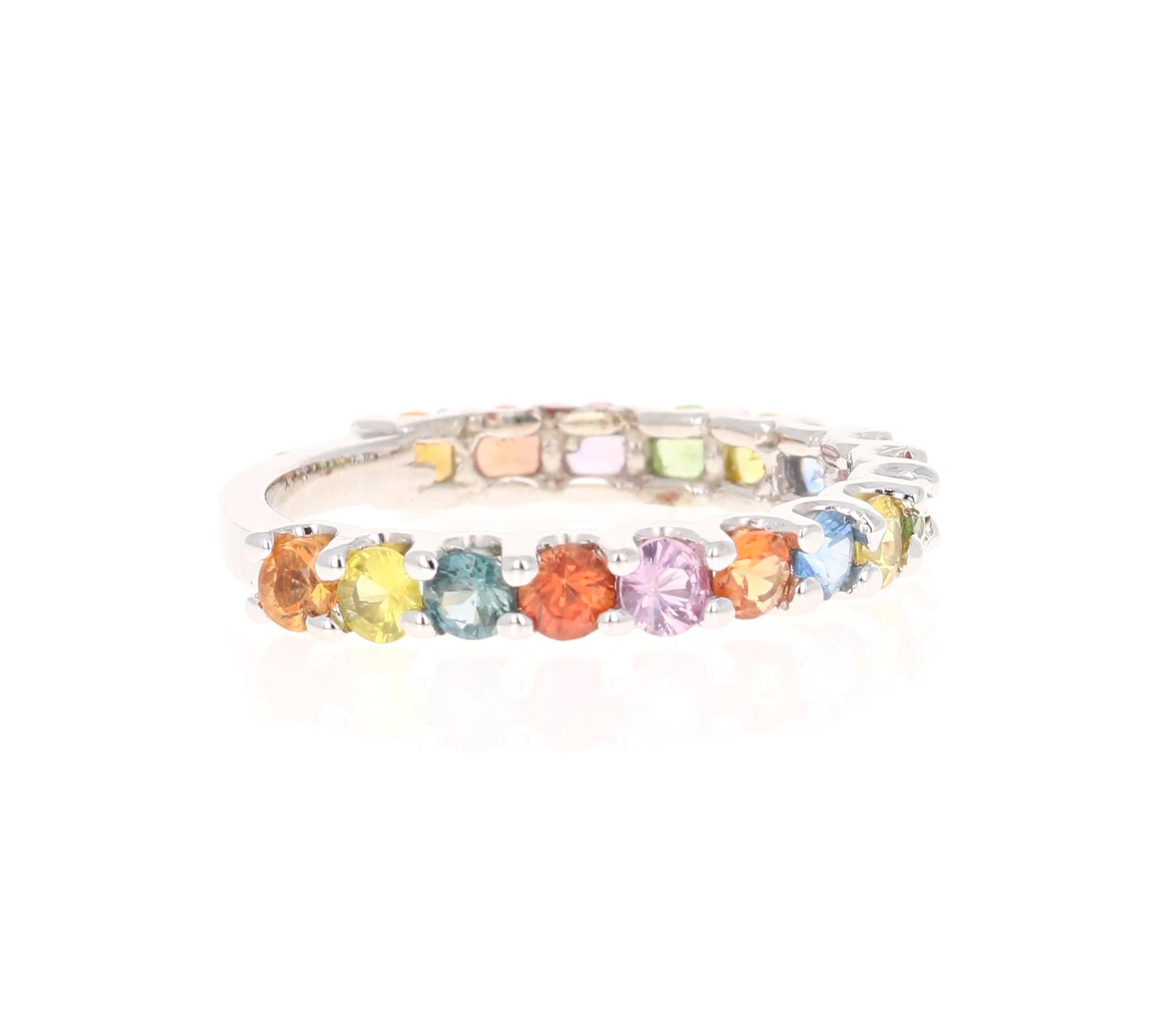 This beautiful band has 17 Multi Colored Sapphires that weigh 1.68 carats. 
The ring is curated in 14 Karat Yellow Gold and weighs approximately 2.2 grams 

It is a ring size 6 3/4 and can be re-sized at no additional charge. 

