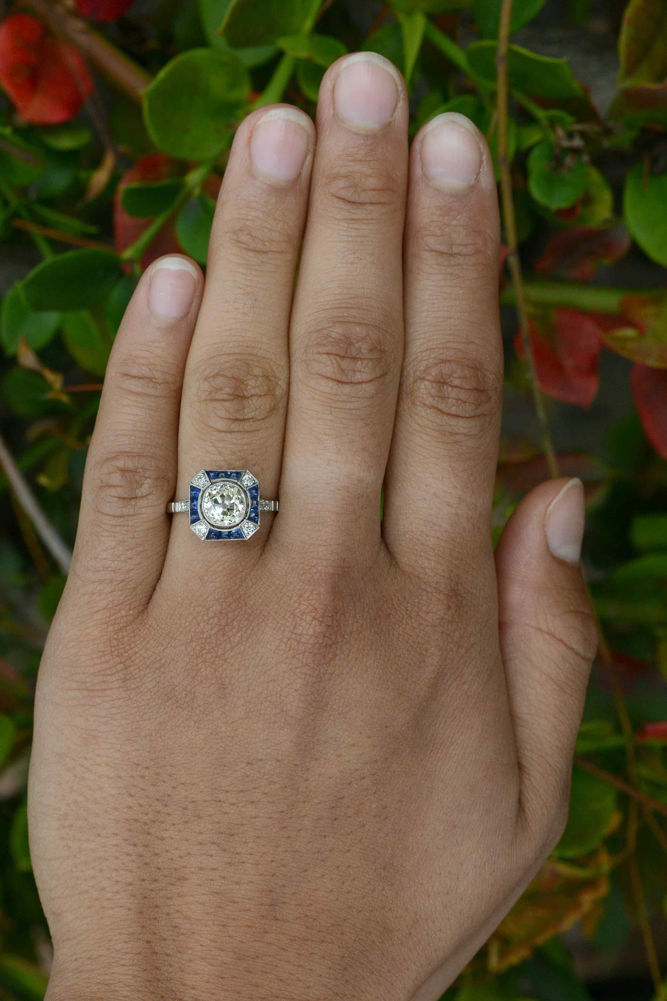 A 1.68 carat old mine cut diamond engagement ring that stuns you with a captivating brilliance emanating from the large facets which were hand-cut to reflect candlelight. Crafted in the spirit of an Art Deco engagement ring, we rescued this old,