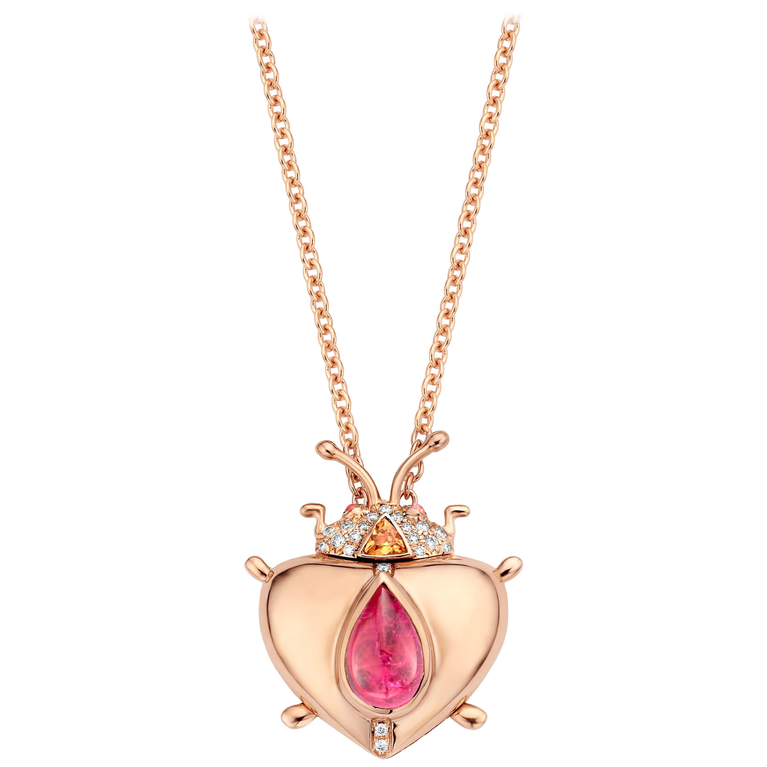 One of a kind lucky beetle necklace in 18K rose gold 17,6g set with the finest diamonds in brilliant cut 0,14Ct (VVS/DEF quality) and one natural, pink tourmaline in pear cabochon cut 1,68Ct. The head is set with a Mandarin garnet in trillion cut