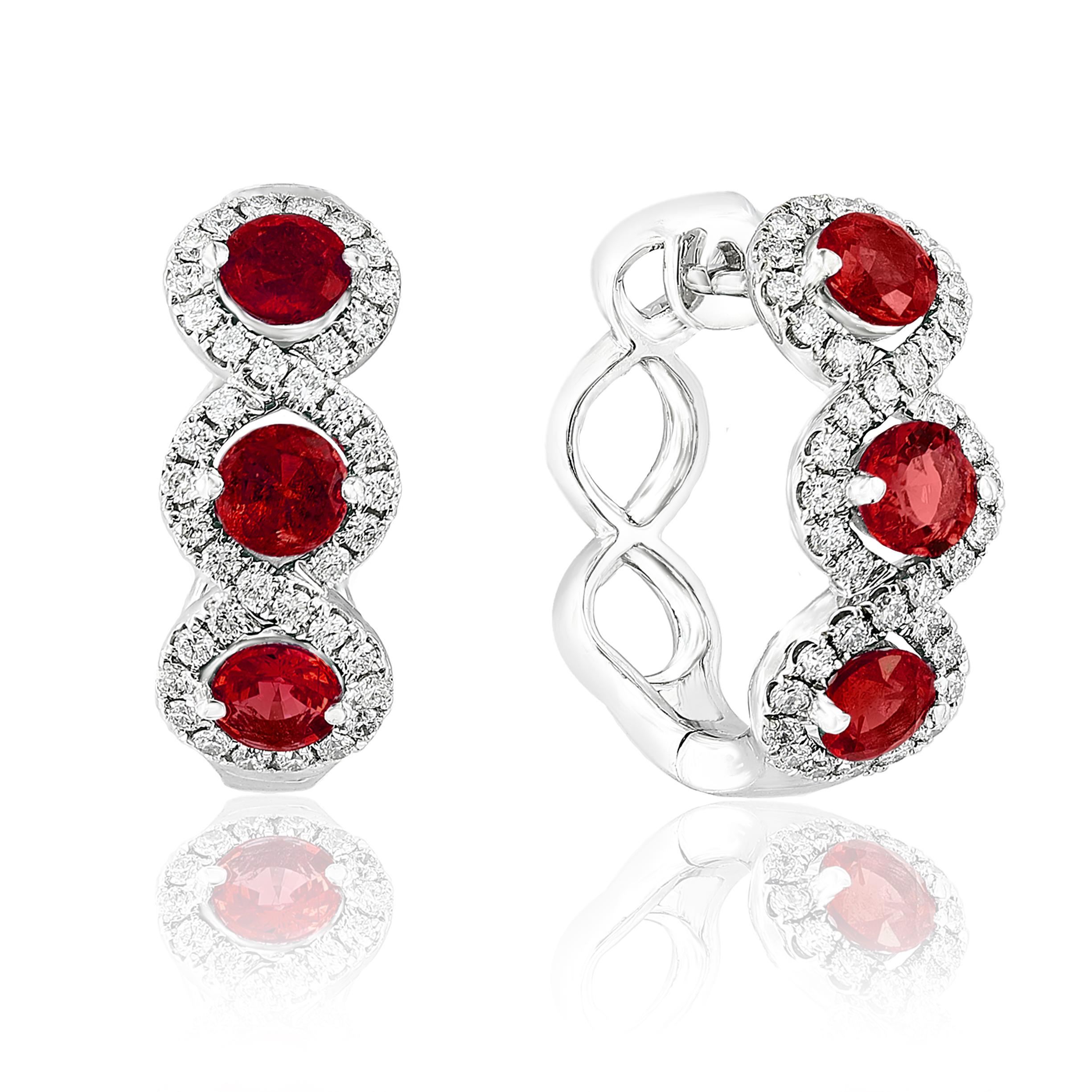 A chic and fashionable pair of hoop earrings showcasing brilliant-cut 6-round rubies weighs 1.68 carats in total, set in 18k white gold.  76 Round diamonds surrounding the rubies weigh 0.65 carats in total. A beautiful piece of jewelry.

Style is
