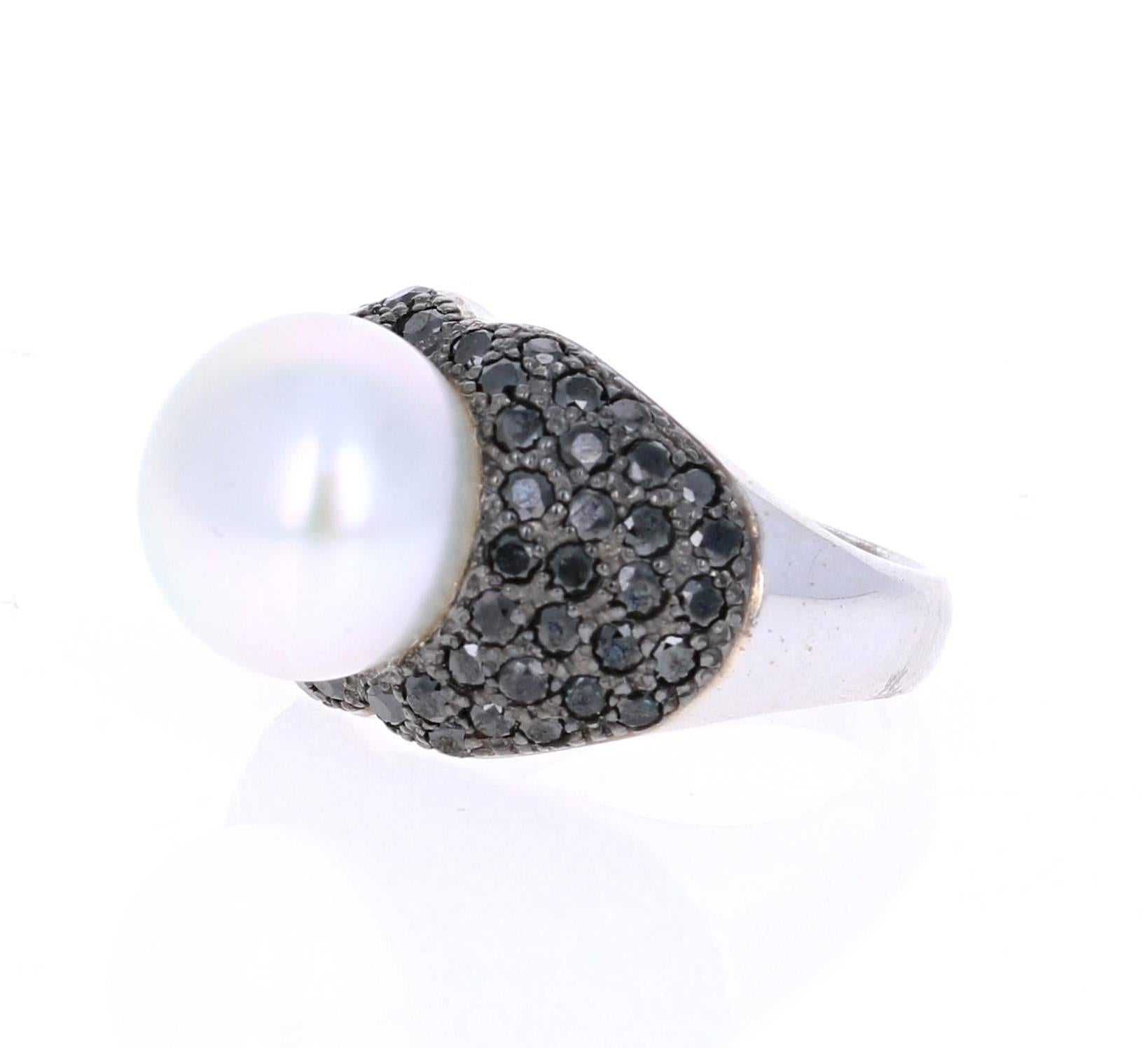 A Gorgeous 1.68 carat South Sea and Black Diamond Cocktail ring that is sure to elevate your look!  There is a beautiful South Sea Pearl in the center of the ring which is surrounded by 60 Black Round Cut Diamonds that give this ring a very elegant