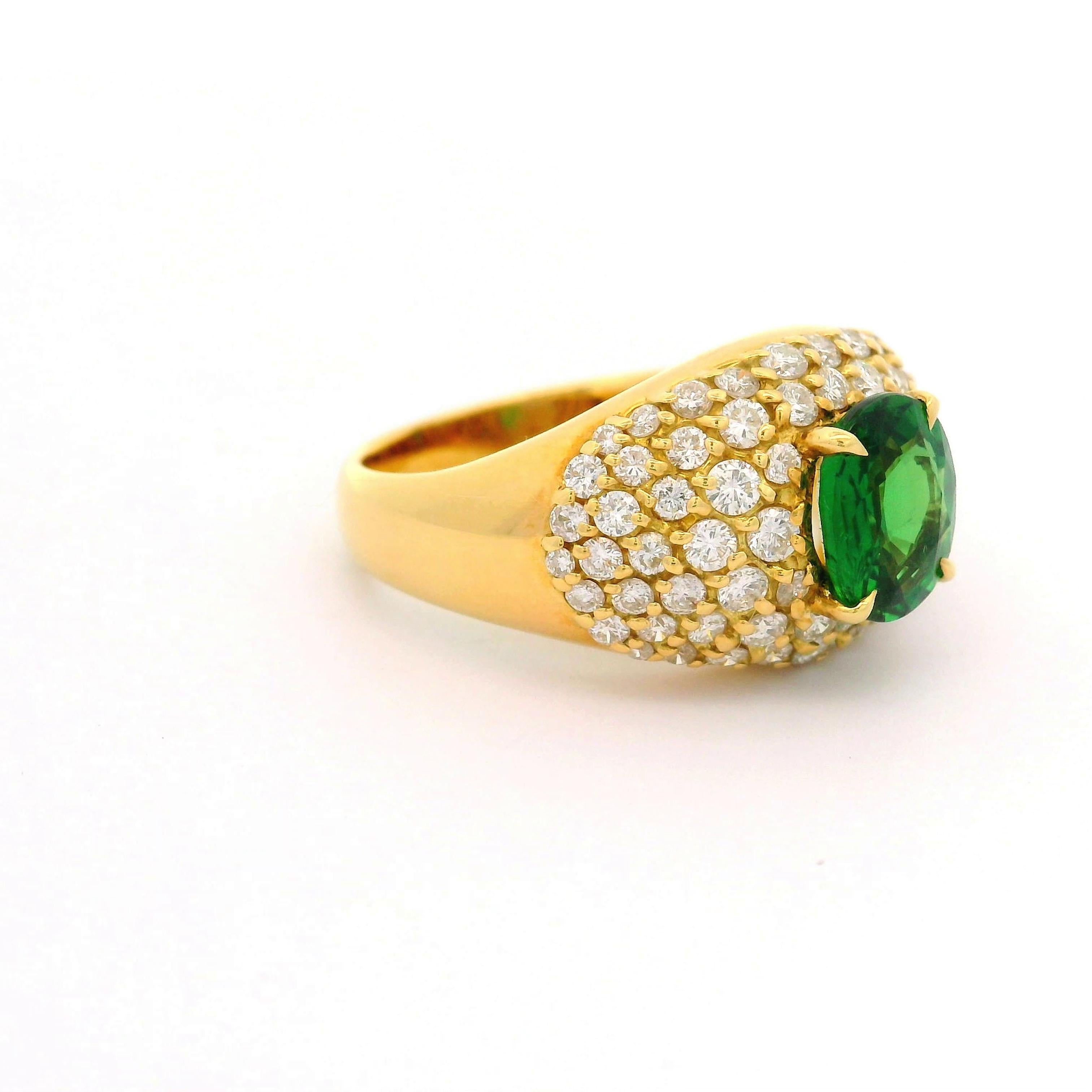 A striking 1.68 carat tsavorite is the centerpiece of this contemporary ring. The tsavorite, in an elegant oval cut, showcases a vivid green hue. Surrounding the tsavorite are 1.18 carats of round-cut diamonds, offering a brilliant white contrast