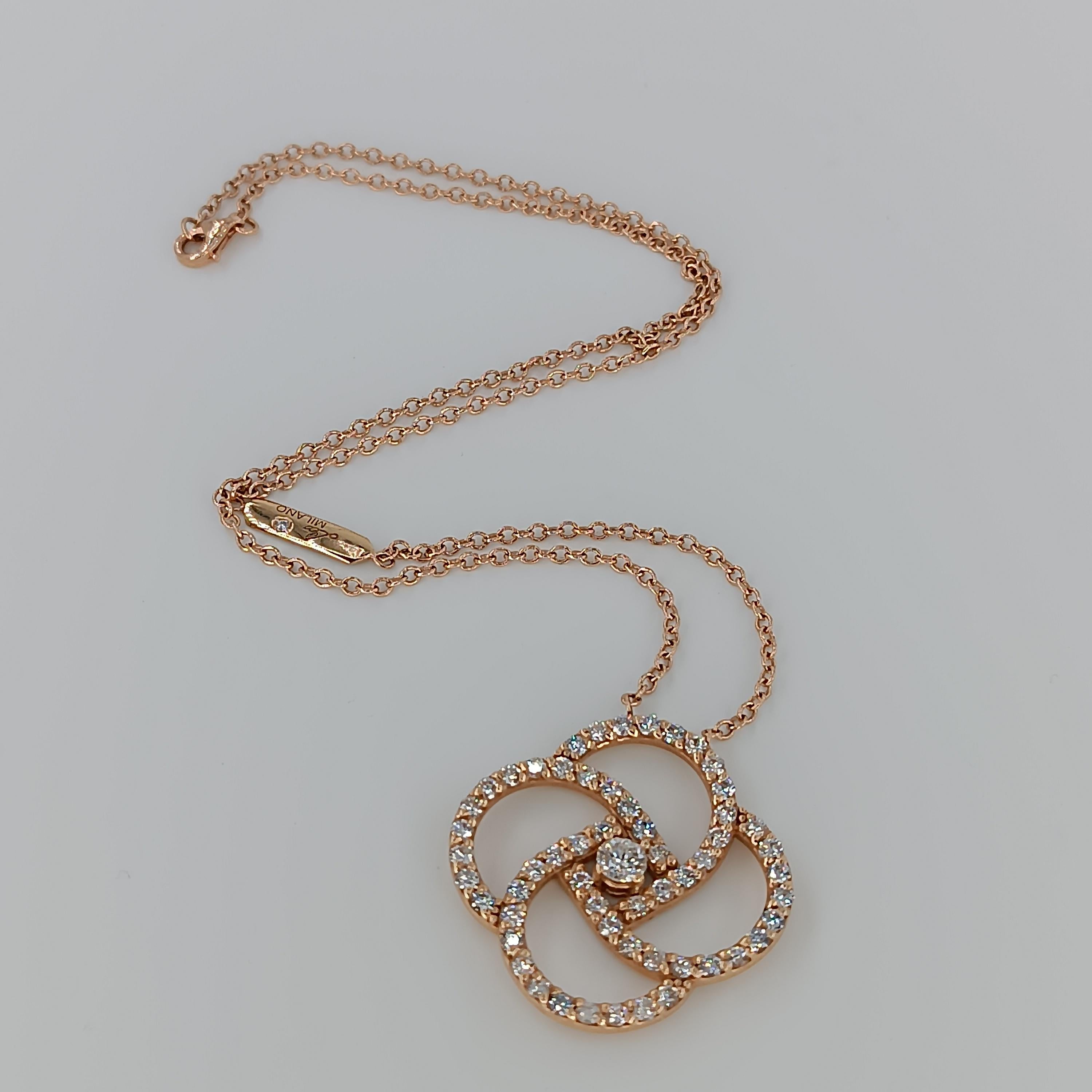 This beautiful pendant made of 18 carat Rose gold for 9.86 grams boasts a central Diamond of 0.25 carat and 56 VS G color diamonds for a total of 1.93 carats. 
any item of our jewelry collection has a dedicated identification number lasered on the