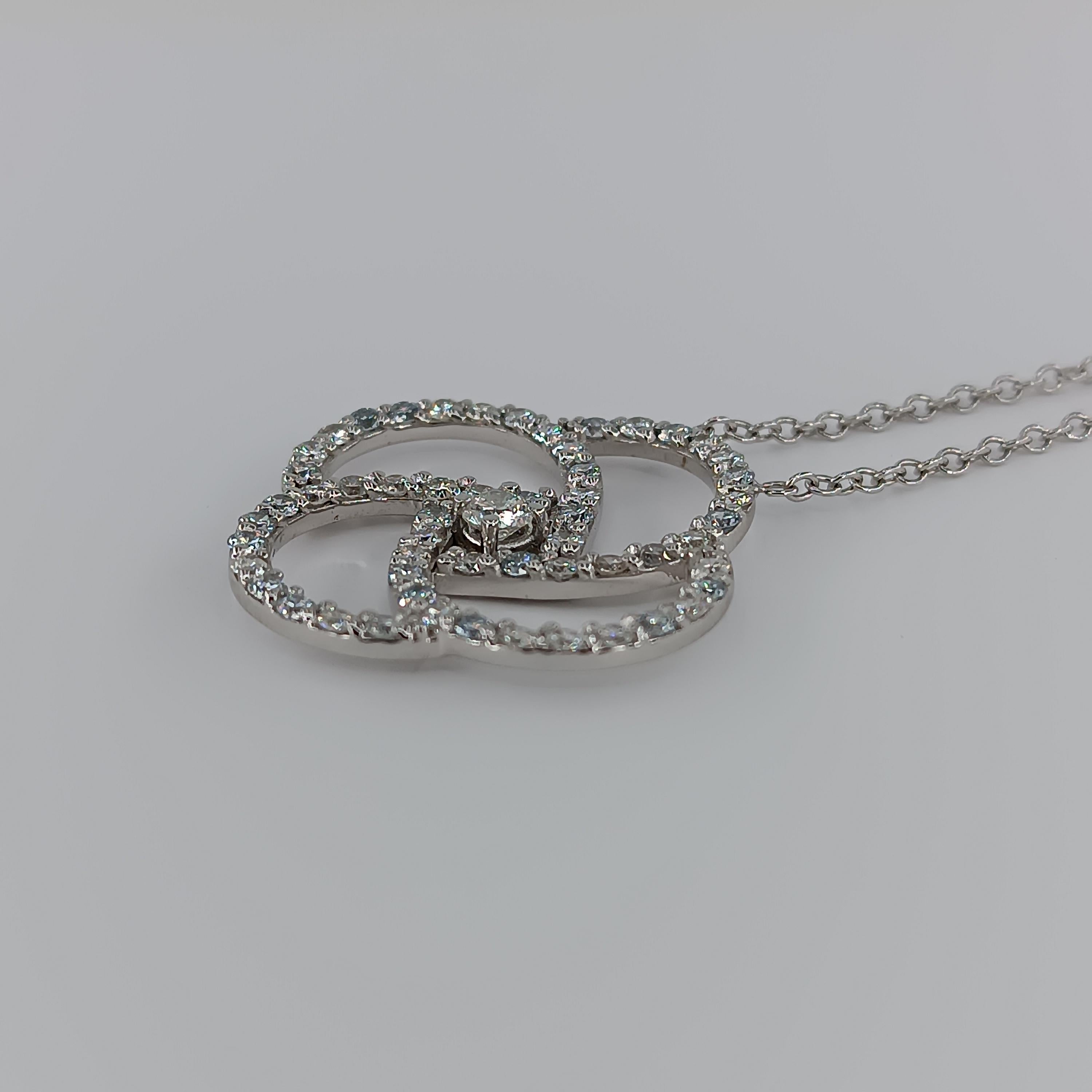 This beautiful pendant made of 18 carat White gold for 9.77 grams boasts a central Diamond of 0.25 carat and 56 VS G color diamonds for a total of 1.93 carats. 
any item of our jewelry collection has a dedicated identification number lasered on the