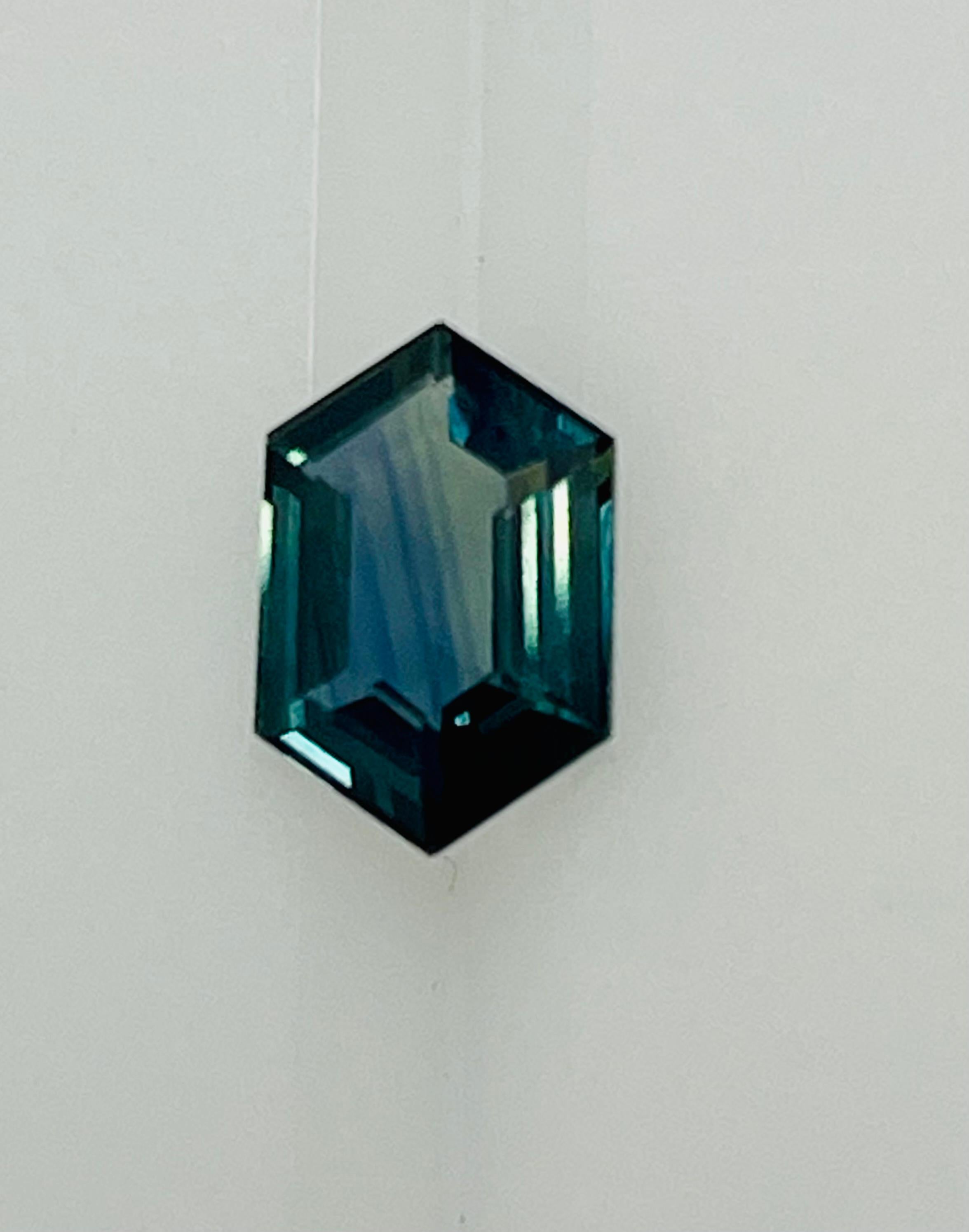 This 1.68 Ct Blueish Green Hexagon sapphire exhibits beautiful mix of blue and green sapphire, which is very unusual and hard to find cutting for sapphires and it has great luster and brilliance mined in Madagascar, cut and polished in Sri Lanka .