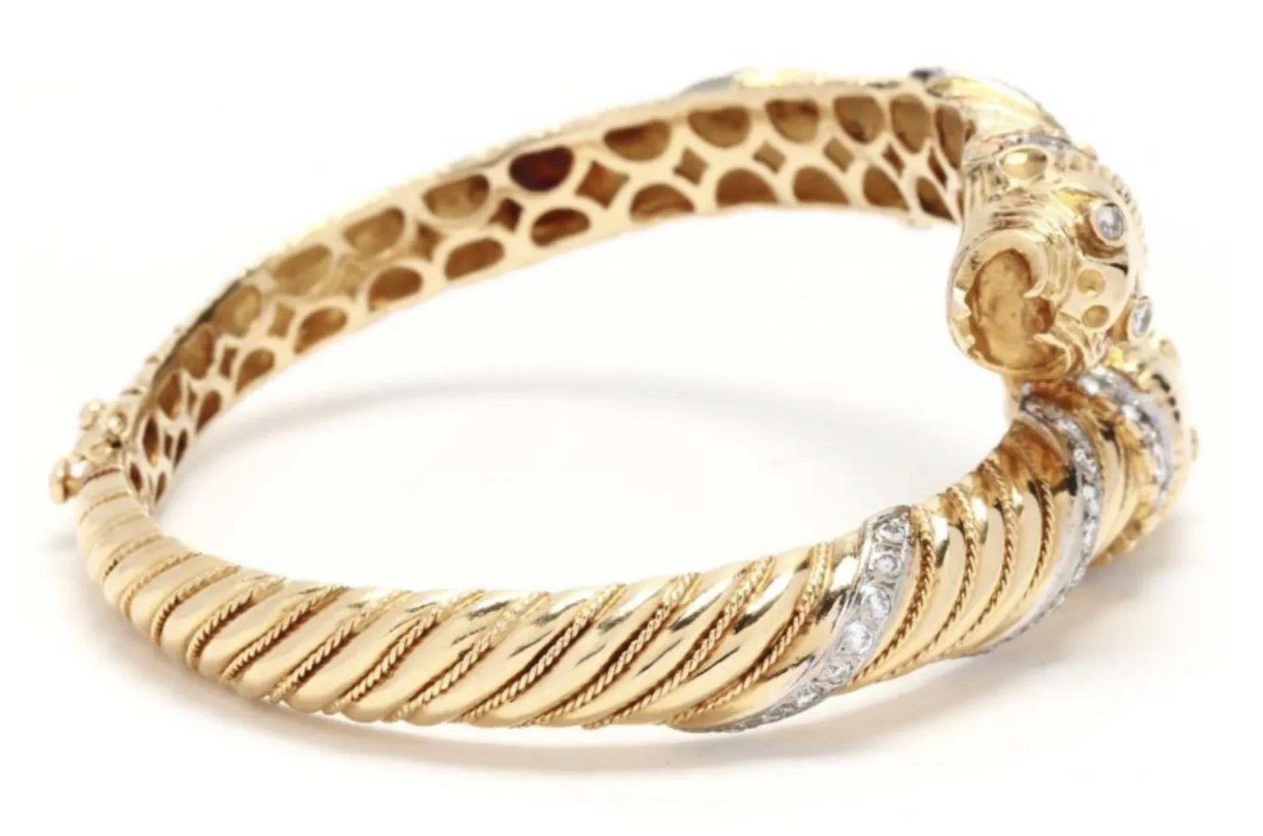 Incredible 18k gold and diamond (approx 1.68 ctw) double chimera panther head bangle. It has a significant amount of diamonds and heavy 18k gold, truly impressive craftsmanship - it is a statement piece with great value.

This bangle is hinged and
