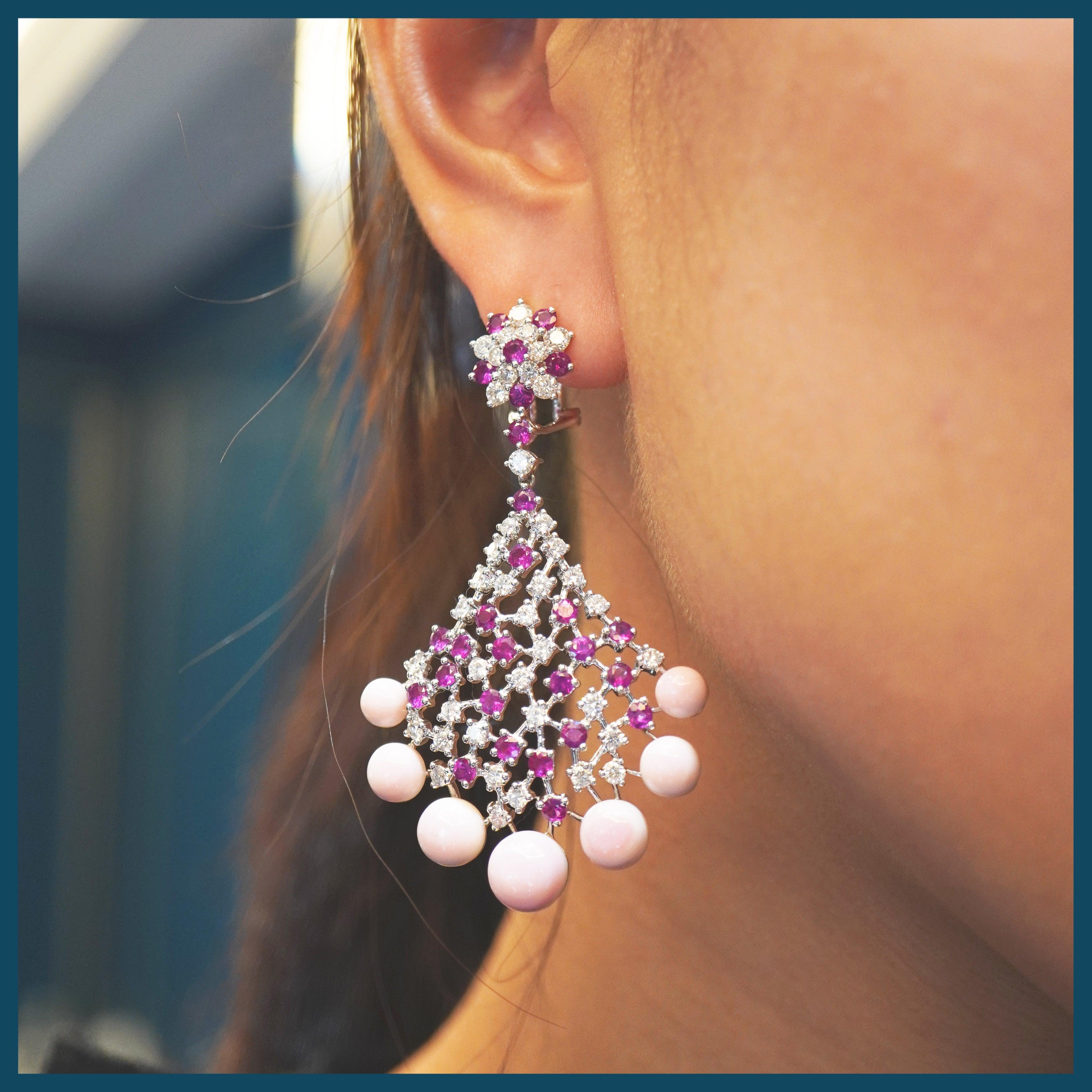 One of our newest innovative collection, 16.80 carat of conch shell are set along with 4.17 carat of vivid red round brilliant ruby from Burma.
The earrings are accented by 3.20 carats of white brilliant round diamond.
The details of the earring are
