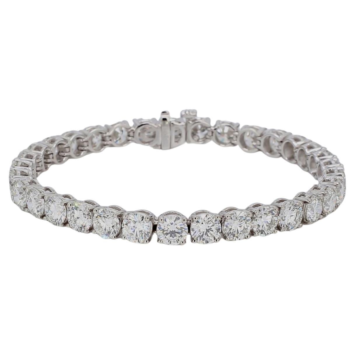 Experience the epitome of elegance and craftsmanship with this 6.75-inch tennis bracelet, masterfully crafted in platinum. 
This exquisite piece features a series of 33 round diamonds, each meticulously set in a secure 4-prong setting. These