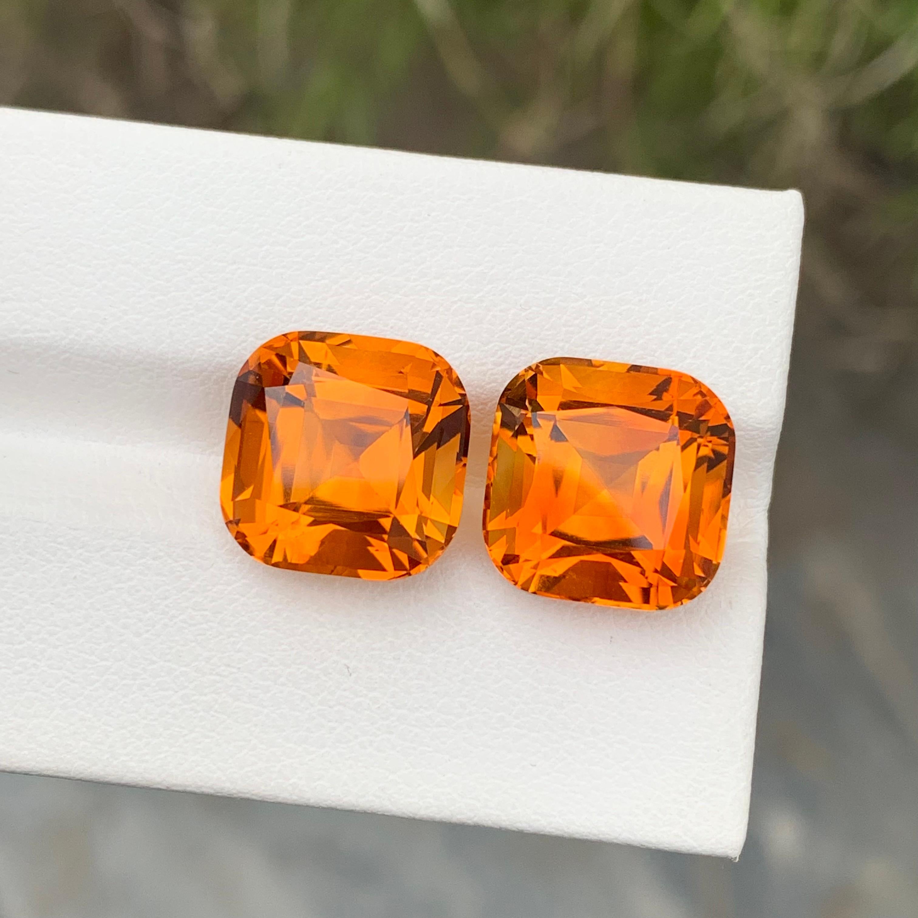 Stone: Mandarin Citrine 
Weight: 16.80 Carats 
Dimension: 12x12x9.2 & 9.3 Mm
Color: Orange
Shape: Cushion
Treatment: Non
.
Mandarin Citrine is a rare and exquisite gemstone known for its vibrant orange-yellow hue reminiscent of ripe mandarin