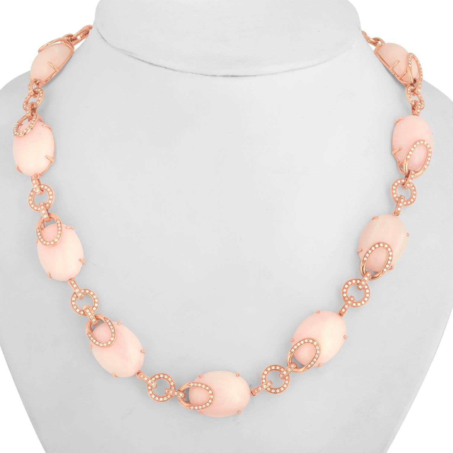 Pink & Peach Opal and Diamond Necklace.
The Necklace is 18K Rose Gold.
The necklace has 1.65ct Diamonds G SI.
There are 168.00 Carats in Peach & Pink Natural
There are 12 Oval Cabochon Pink & Peach Natural Opals.
The necklace weighs 63.9 grams.
The