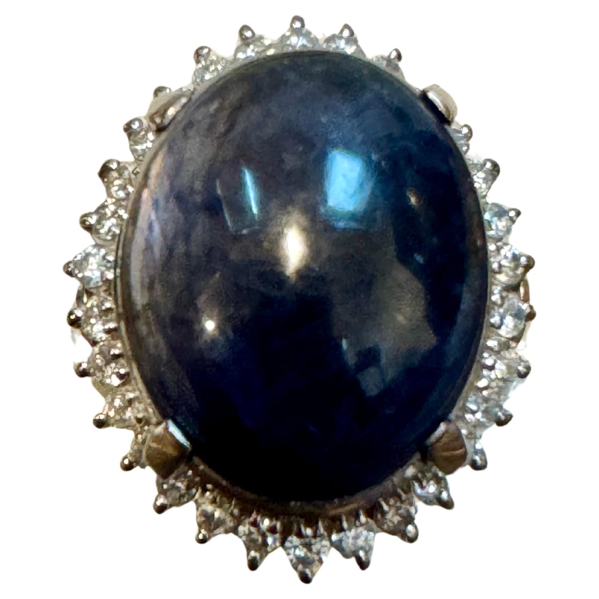 16.83 Ct Natural  Sapphire Cabochon & Diamond  Ring in Platinum Size 7
Platinum 15.8 Grams
I am basically charging for mounting and diamonds .
Sapphire Cabochon  size 16.4X13MM
Huge Sapphire but Sapphire is of ordinary quality
Ring Size 7  ( it can