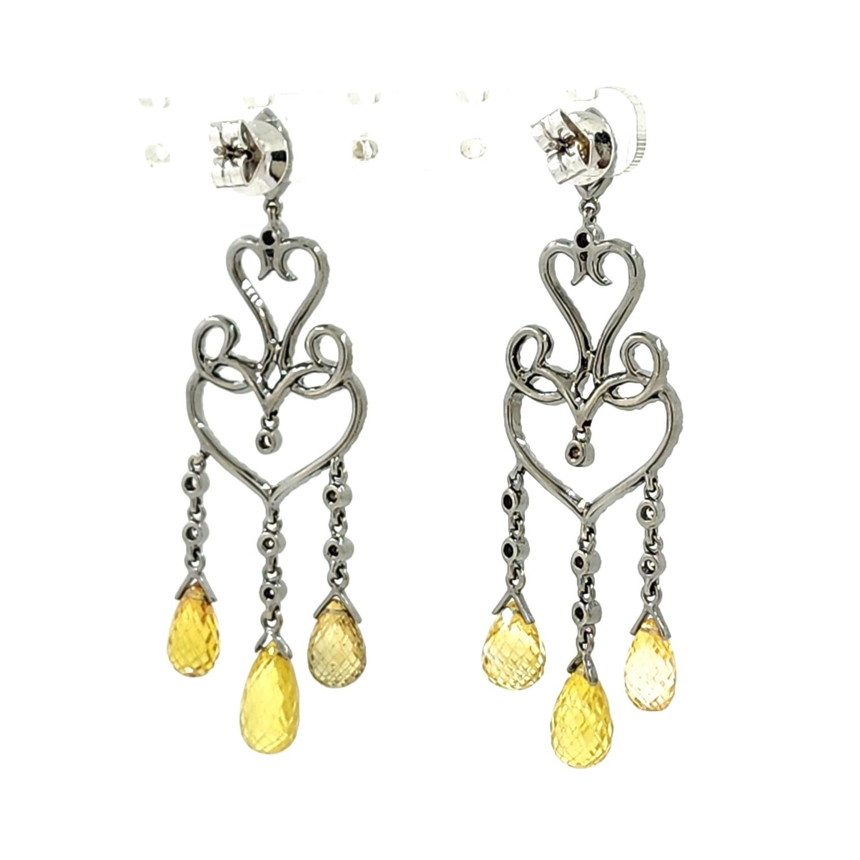 Introducing our exquisite Vintage 16.83ct Fancy Yellow Sapphire Briolettes and Diamond Dangle Drop Earrings in 18K White Gold. These earrings are a true testament to the beauty and rarity of natural gemstones, designed to make a bold and glamorous