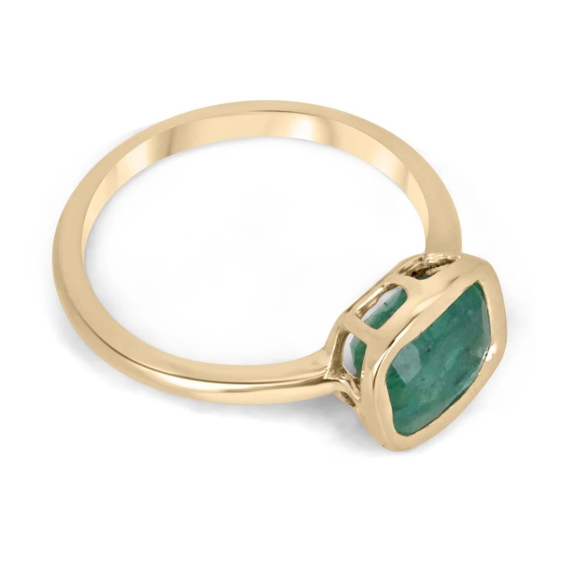 Introducing a captivating solitaire ladies' ring featuring a striking 1.68-carat cushion cut emerald of dark green color, offering a remarkable play of dim light and good clarity despite some superficial scratches on its surface. The emerald is