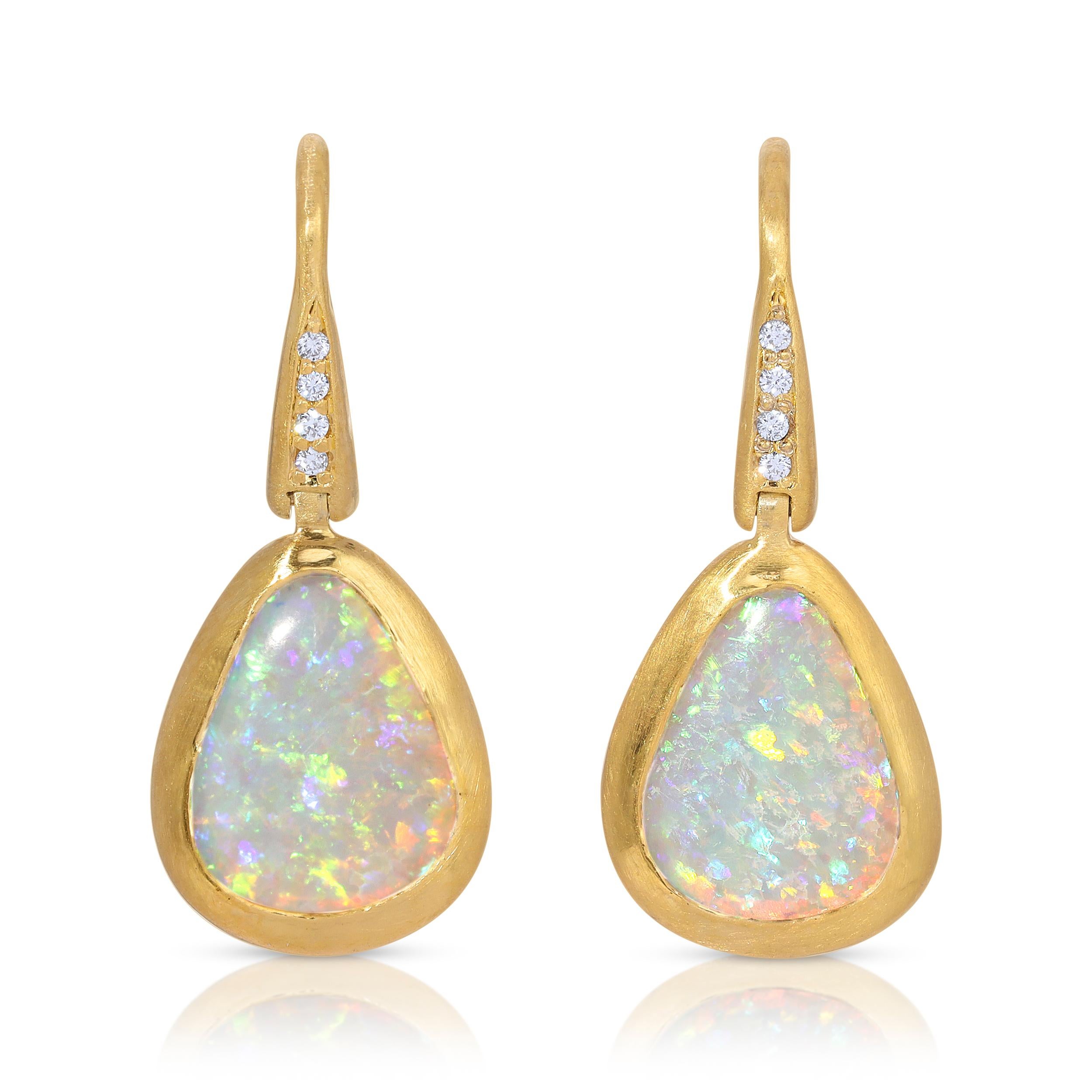 These earthy Winton Australian Crystal Opal Earrings are 1.68ct and are accented with .04ct vs quality Diamonds set in 18k Matte Yellow Gold.  The Opal drop is attached by a hinge for movement. 