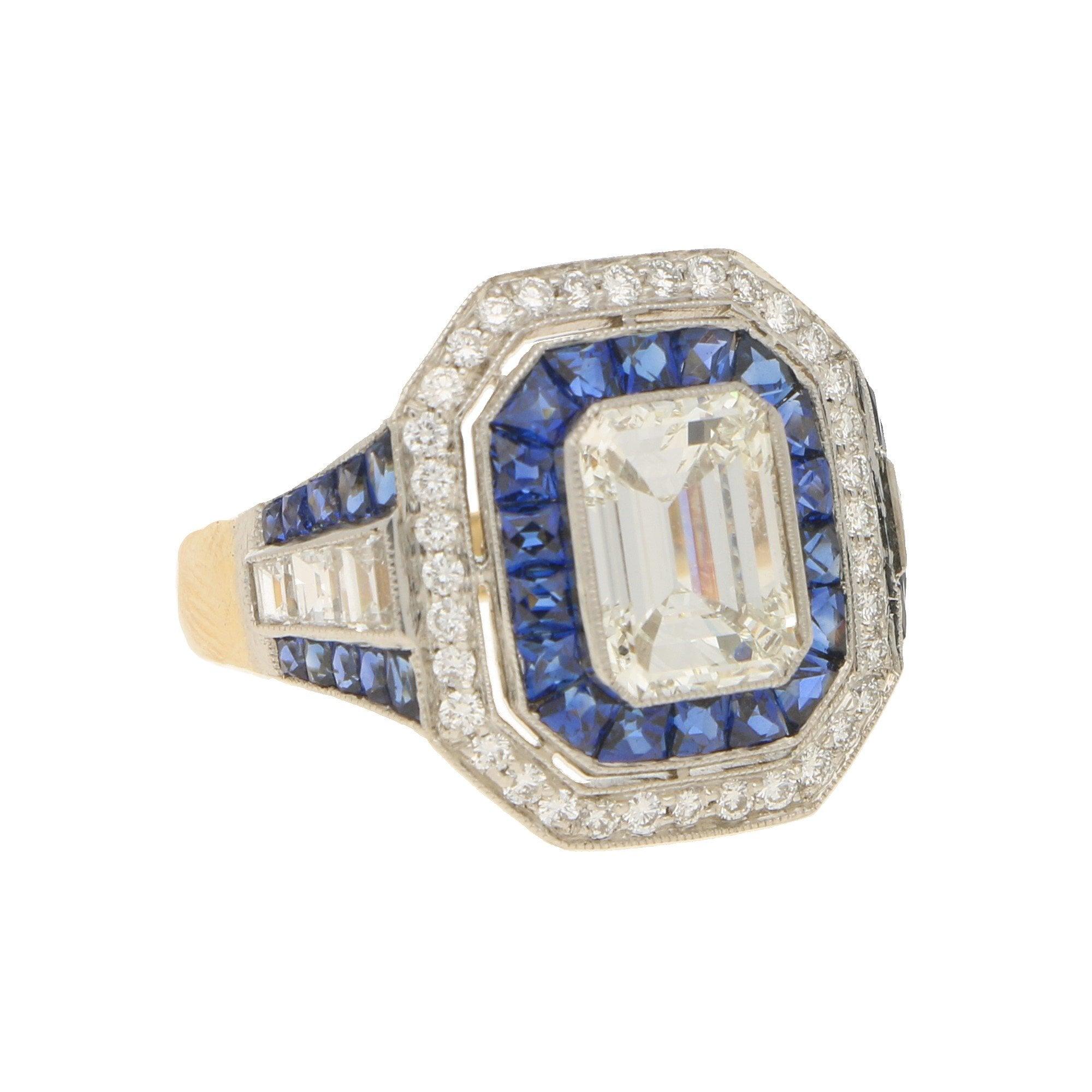 Main diamond accompanied by a GIA certificate stating it is 1.68 carats, I colour, SI1 clarity. Remaining diamonds approximately 0.70 carats in total, F/G colour, SI clarity. Sapphires approximately 1.30 carats in total, blue colour.

A vintage Art