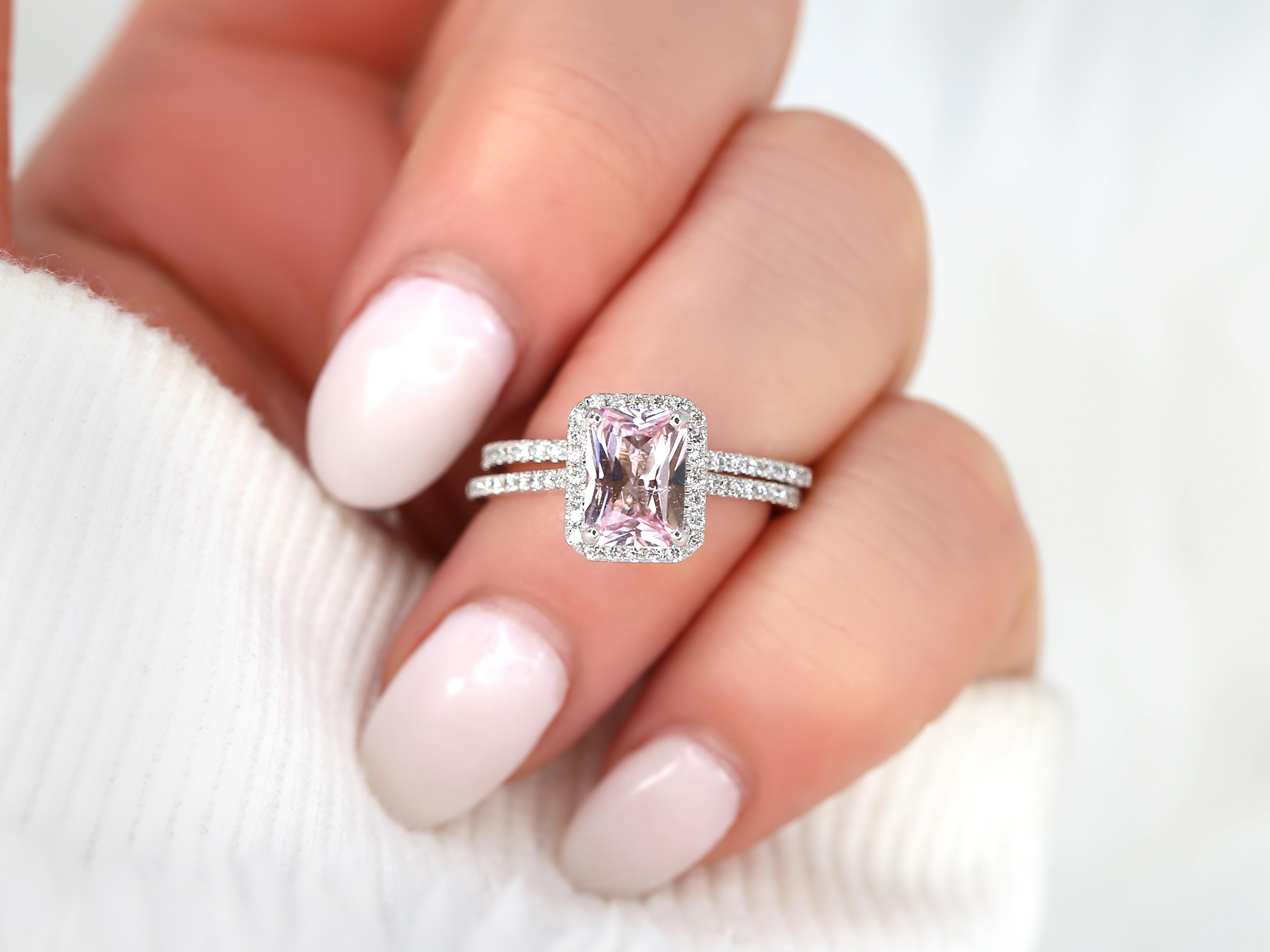 Experience the enchantment of our radiant blush sapphire halo bridal set in white gold. Featuring a dazzling blush sapphire center stone surrounded by a shimmering halo of diamonds, this set embodies elegance and grace. Crafted in white gold, it
