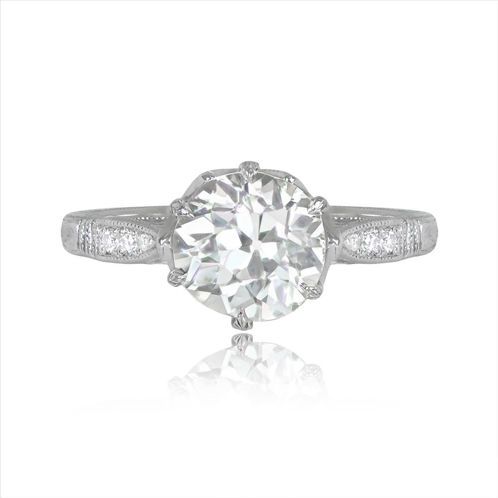 Prepare to be captivated by the sheer beauty of this stunning ring. Its centerpiece is a mesmerizing old European cut diamond, weighing a remarkable 1.68 carats, lovingly cradled in prong settings. The diamond's enchanting K color exhibits a warm