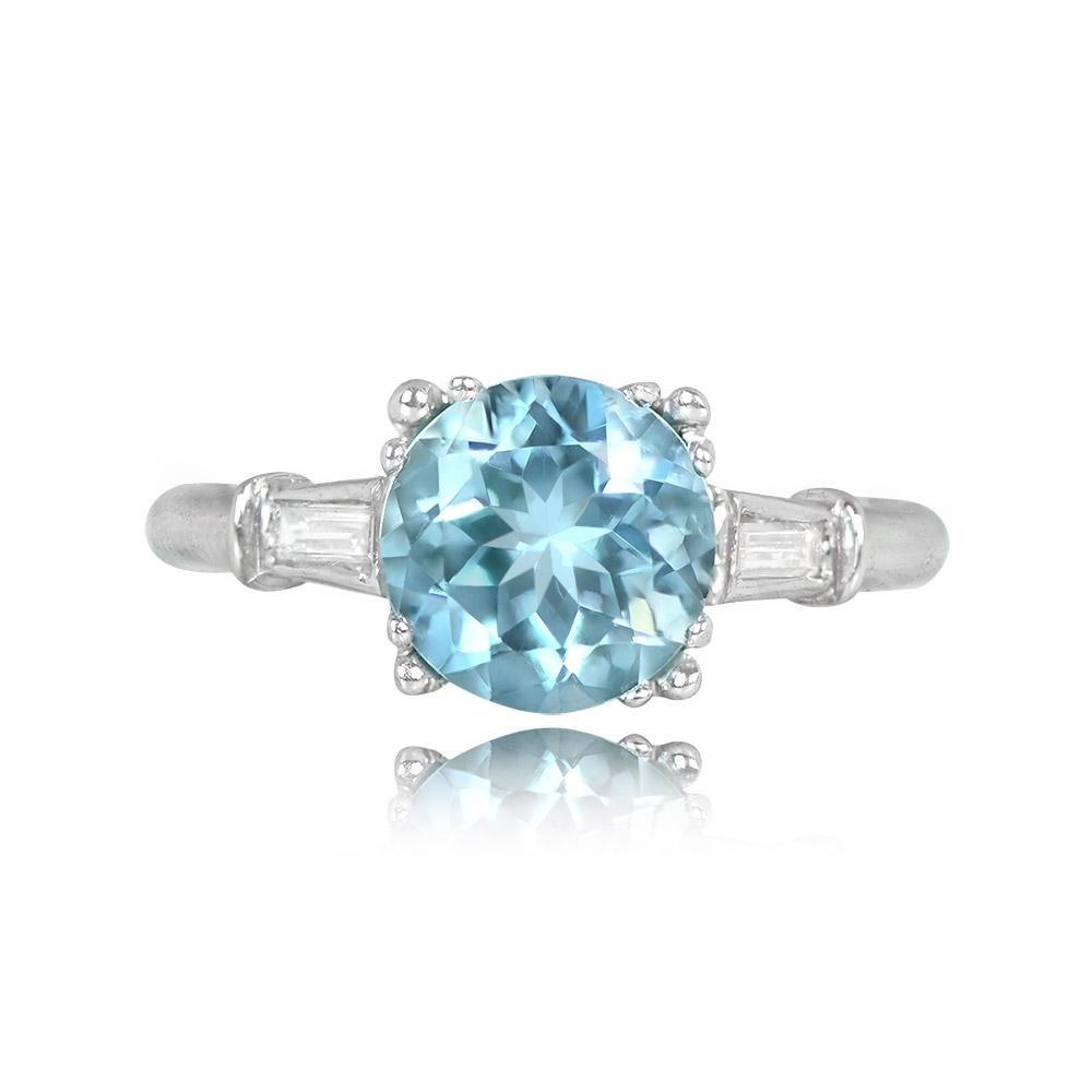 A stunning ring with a 1.68-carat round aquamarine set in prongs, complemented by two tapered baguette cut diamonds on the shoulders, totaling around 0.20 carats. Crafted in platinum.


Ring Size: 6.5 US, Resizable
Metal: Platinum
Stone: Diamond,