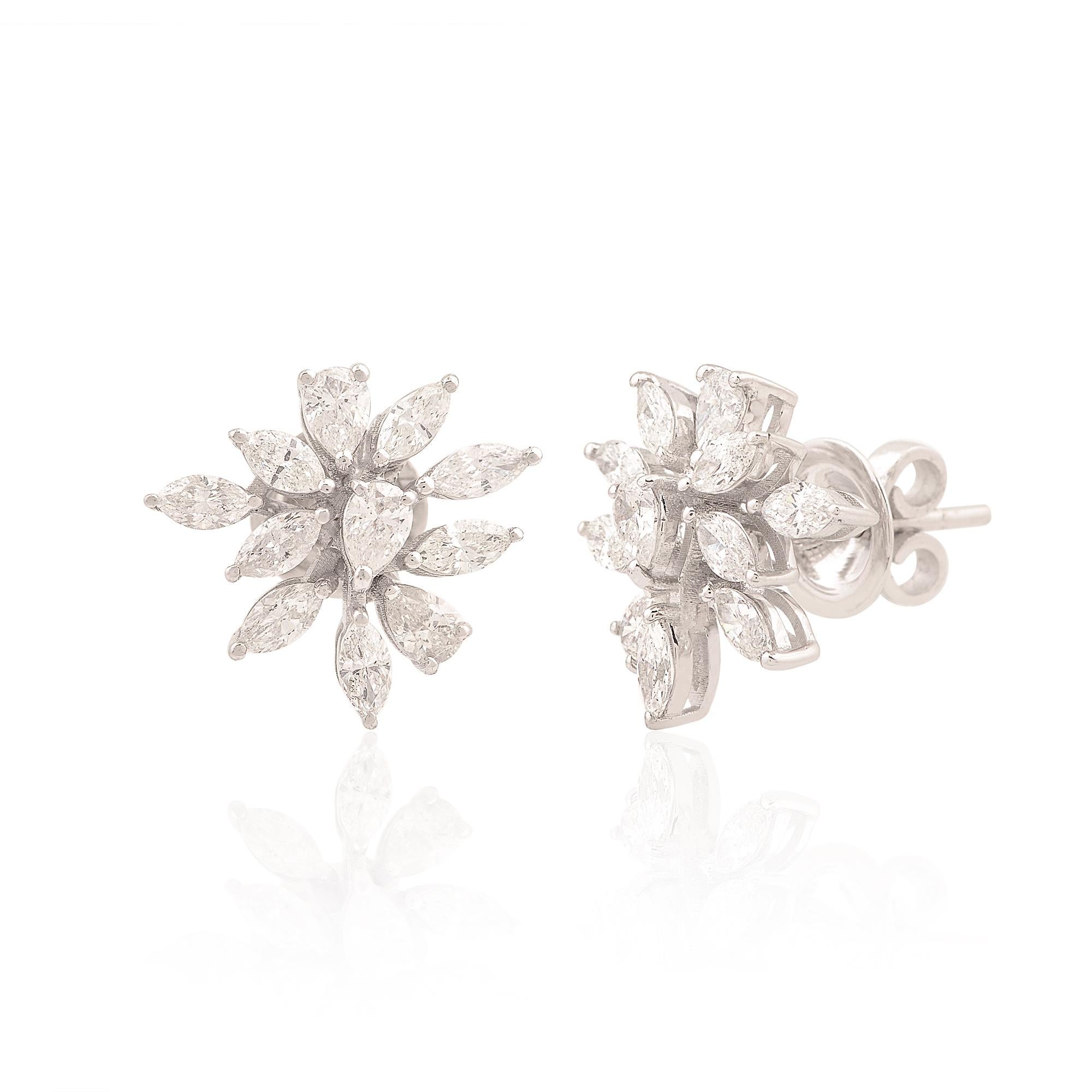 At the heart of each earring lies a magnificent marquise-cut diamond, meticulously selected for its exceptional clarity, brilliance, and fire. With a combined weight of 1.69 carats, these diamonds radiate with a mesmerizing allure, captivating all