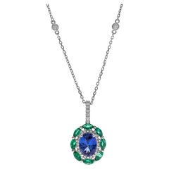 1.69 Carat Oval Tanzanite Round Emerald and Round Diamond 14K White Gold Pendant