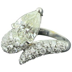 Used 1.69 Carat Pear Shaped Diamond Ring with 52 Diamonds Swirl Band in 18 Karat Gold