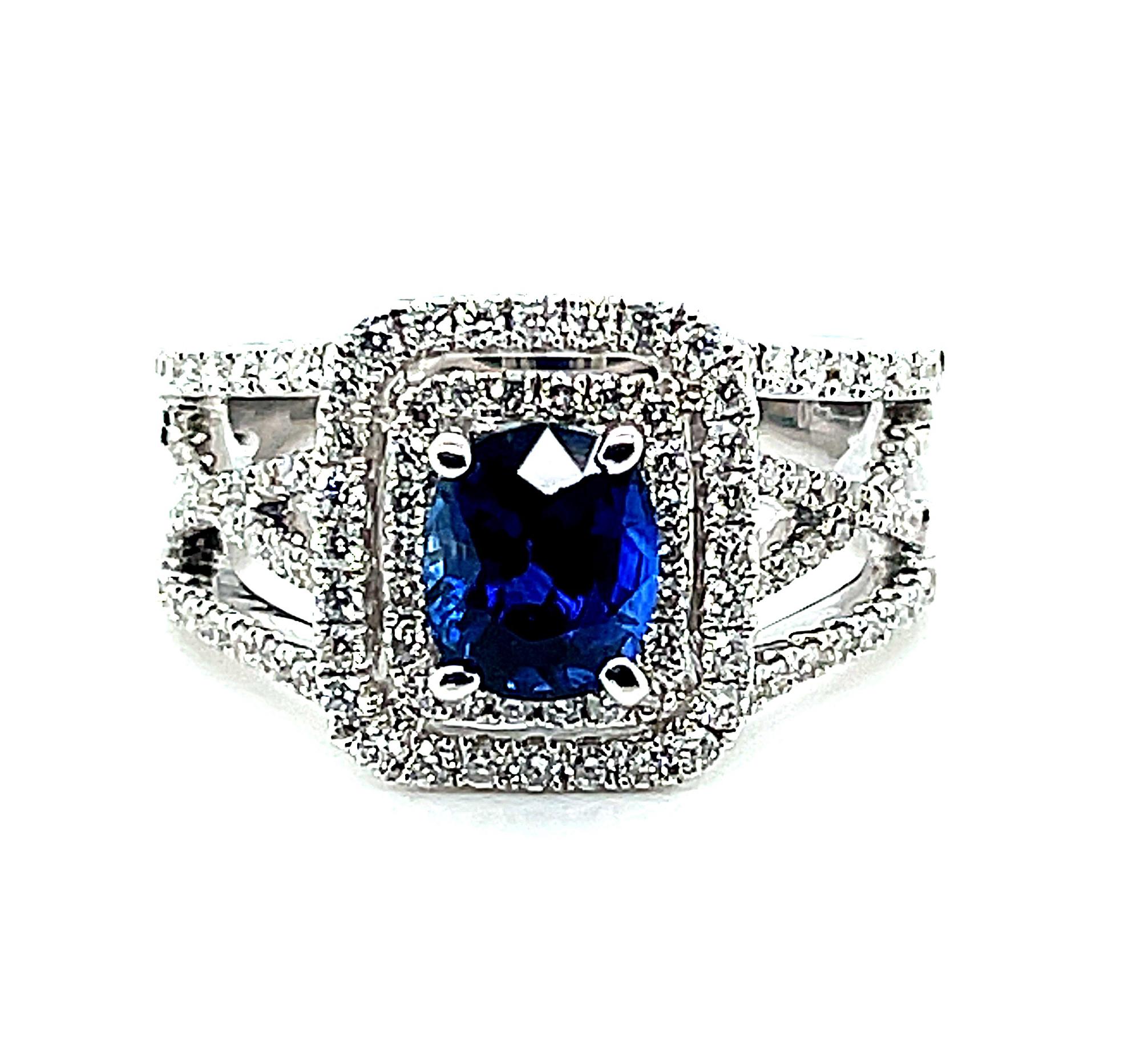 This gorgeous sapphire ring is a perfect blend of timeless elegance and contemporary sophistication. It starts with a velvety 1.69 carat blue sapphire framed in a double halo of sparkling diamonds, then takes an updated turn with multiple lines of