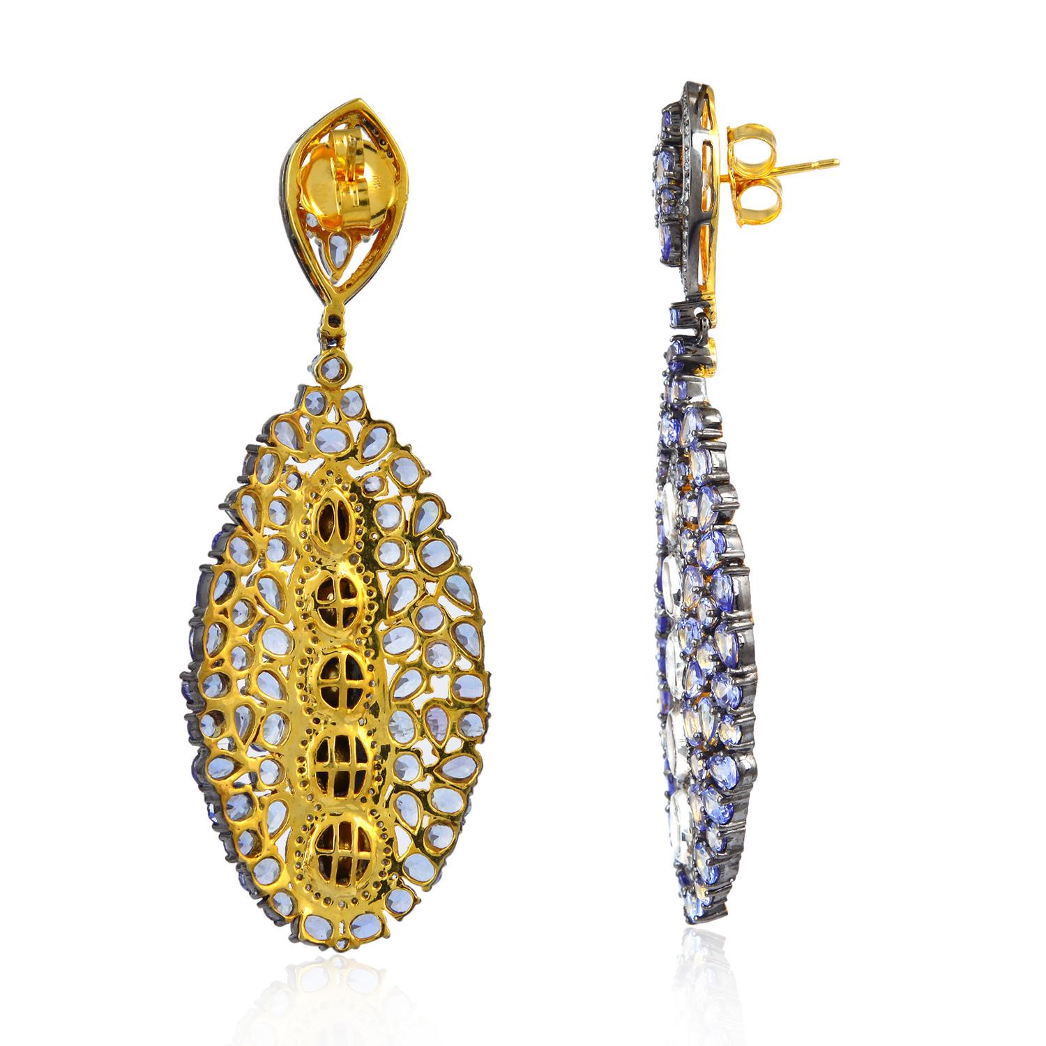 These stunning earrings are handmade in 18-karat gold and sterling silver.  
It is set with 16.91 carats tanzanite and 3.14 carats diamonds in blackened finish. 

FOLLOW  MEGHNA JEWELS storefront to view the latest collection & exclusive pieces. 