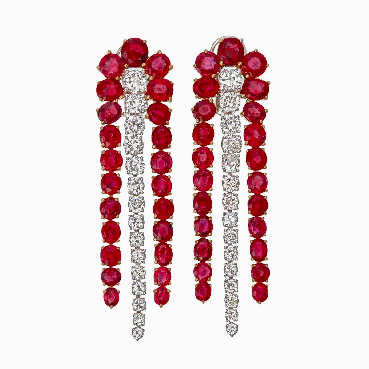 A vibrant and sophisticated ruby and diamond chandelier earrings presented to you by Rewa jewels in 18 karat white gold.

This piece is decorated with 46 pieces of Burma rubies weighing approximately 16.96 carat total. These rubies are untreated.