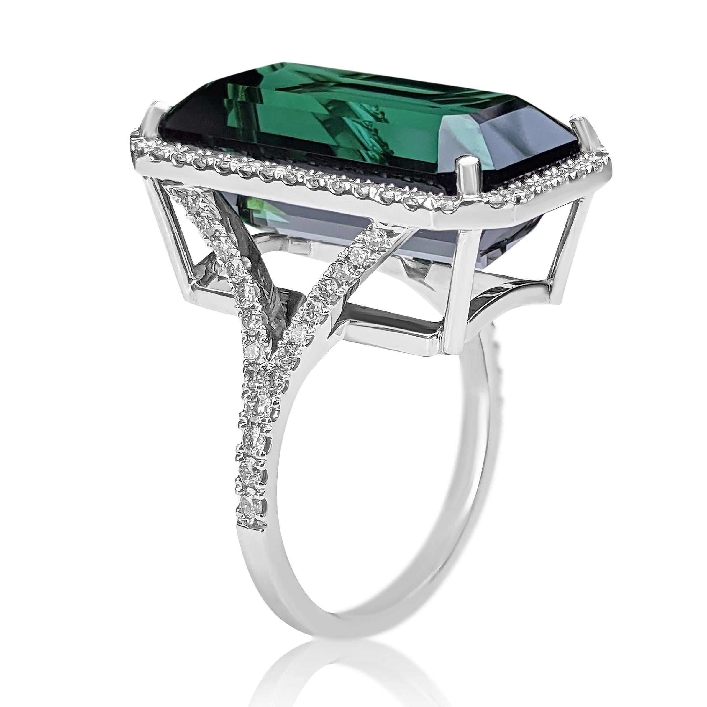 Ring can be sized free of charge prior to shipping out.

Center Stone:
___________
Natural Tourmaline
Cut: Cut Cornered Rectangle Step Cut
Carat: 16.97 ct
Color: Green

Side Stones:
___________
Natural Diamonds
Cut: Round 
Carat: 1.00 tccw
Color: