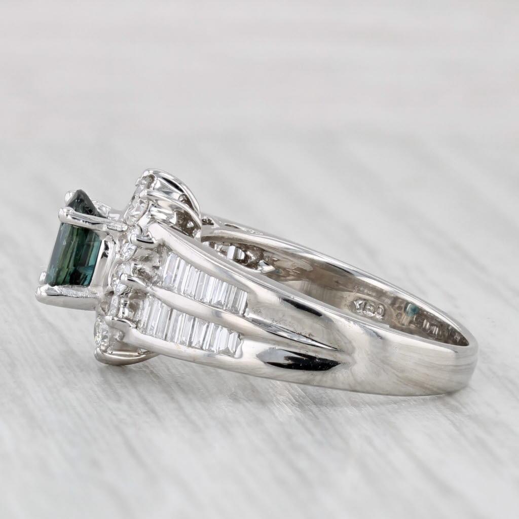 Gemstone Information:
- Natural Sapphire -
Carats - 0.90ct
Cut - Oval Brilliant
Color - Dark Blue
Treatment - Heated

- Natural Diamonds -
Total Carats - 0.39ctw
Cut - Round Brilliant
Color - F - H
Clarity - VS2 - SI1

- Natural Diamonds -
Total