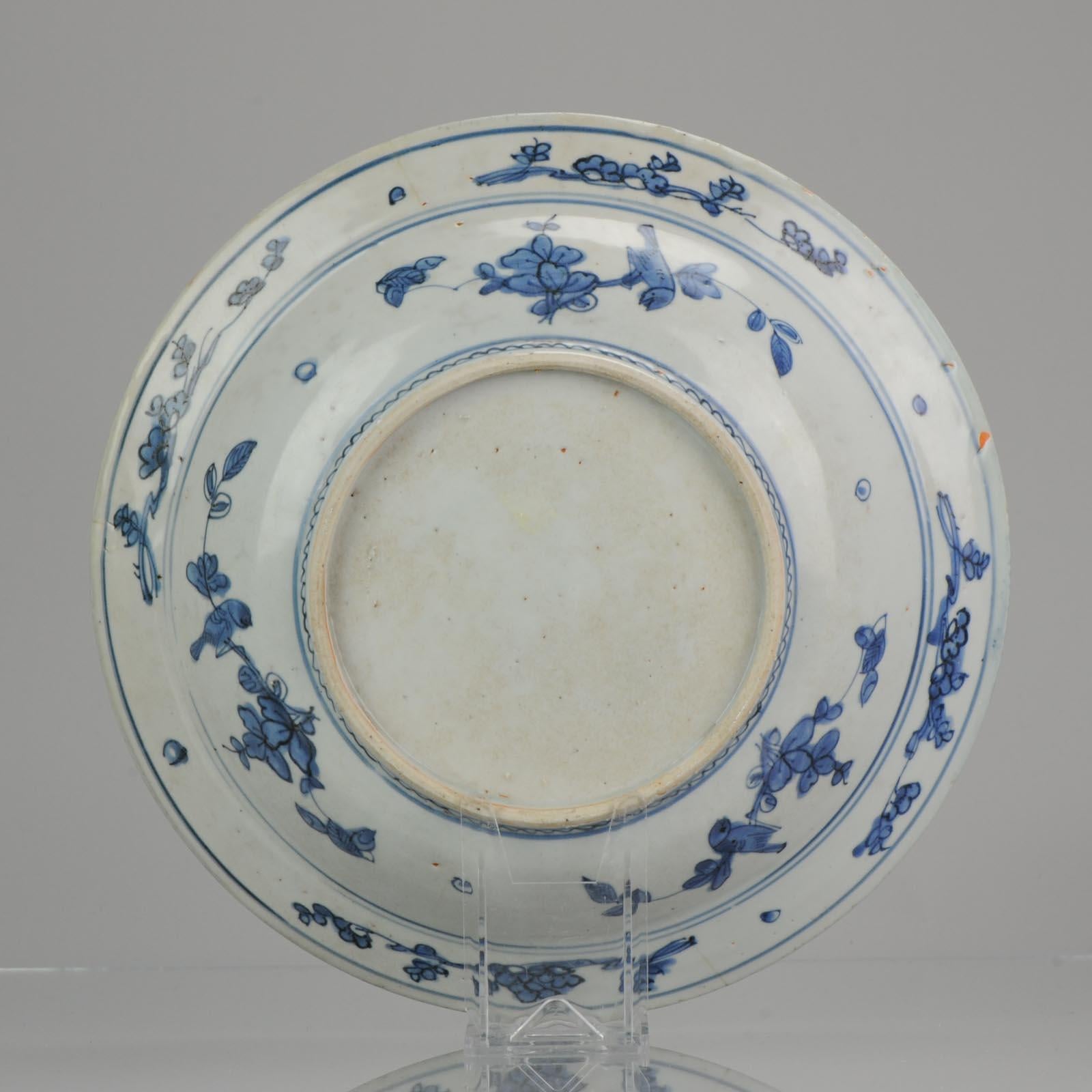 Large and very nice blue and white Charger/dish from the Ming period. Jiajing or Wanli. Absolute rare item.

Dish on footring, decorated in underglaze blue. The dish is decorated with two birds perched beside a peony with flower scrolls to the