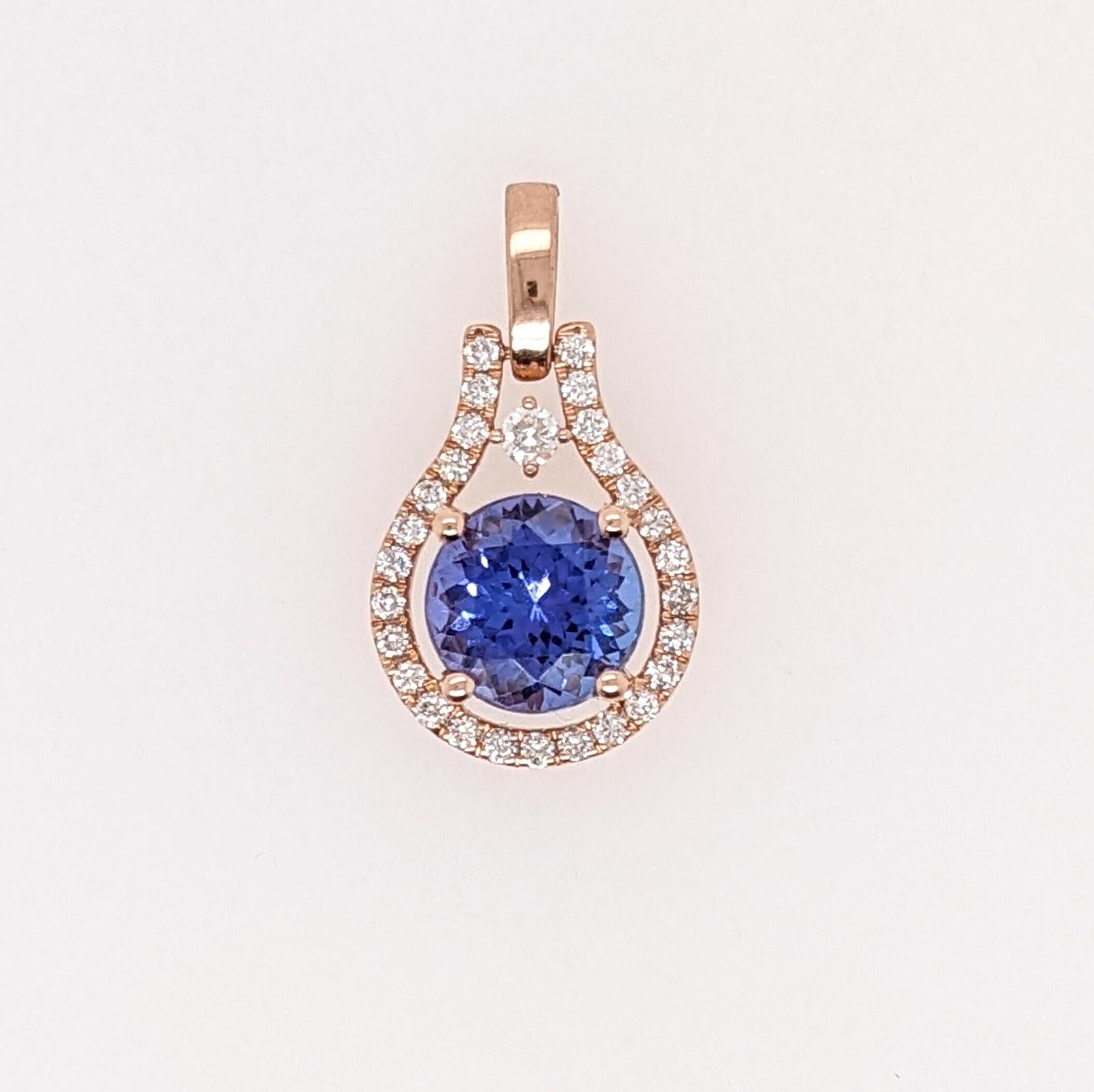 This beautiful pendant features a round 1.65 carat tanzanite with earth mined diamonds all set in solid 14K gold. This pendant also makes a great december birthstone gift for your loved ones!

Specifications

Item Type: Pendant
Center Stone: