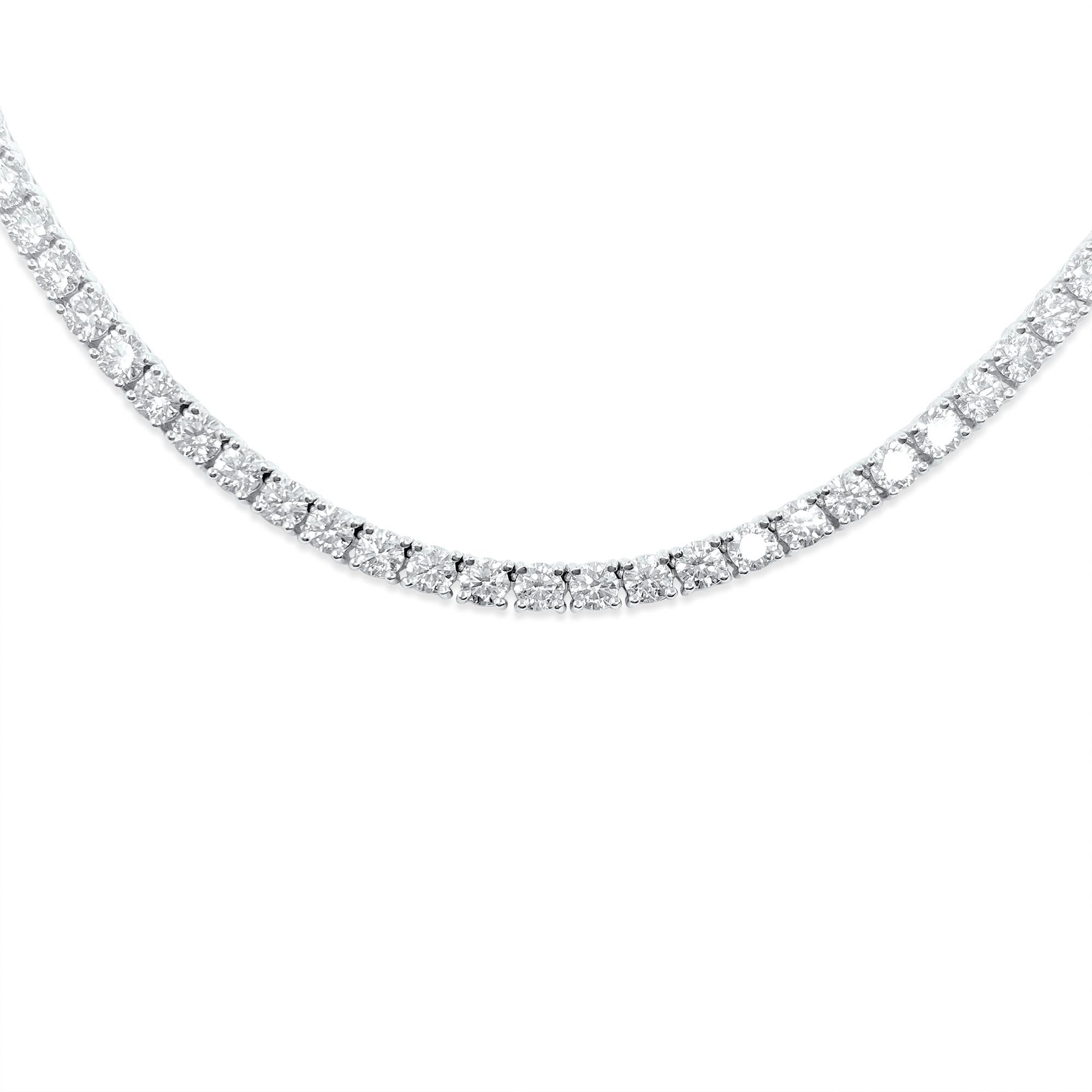 Crafted in lustrous 14k white gold, this stunning tennis necklace boasts a breathtaking total weight of 16 carats of round brilliant cut diamonds, showcasing VVS-VS clarity and H-I color for exceptional brilliance. Each diamond is 100% natural earth