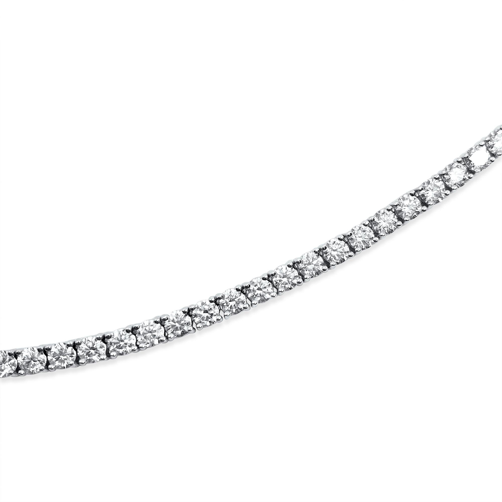 Crafted in lustrous 14k white gold, this stunning tennis necklace boasts a breathtaking total weight of 16 carats of round brilliant cut diamonds, showcasing VVS-VS clarity and H-I color for exceptional brilliance. Each diamond is 100% natural earth
