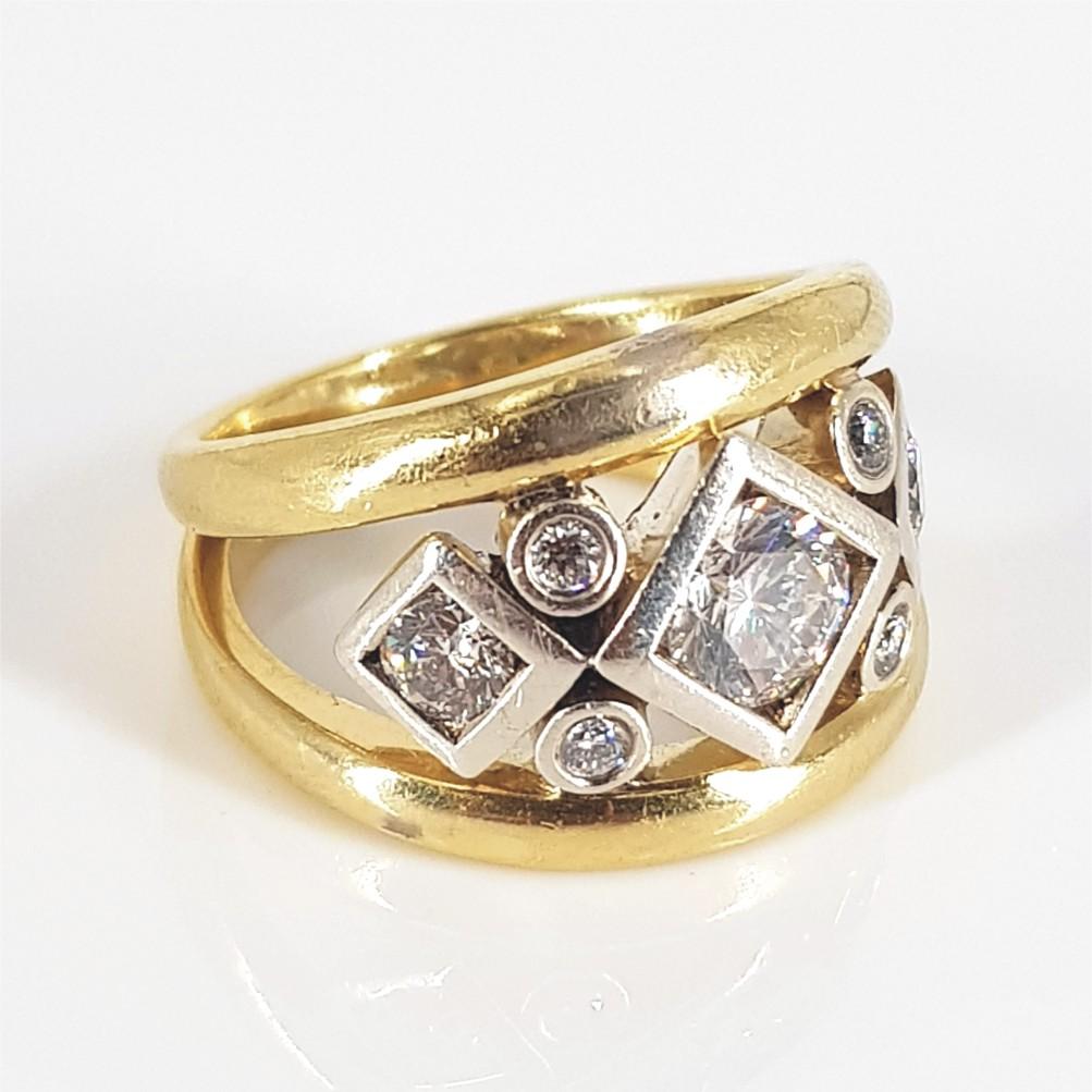 Striking, beautiful and bold, this ring says it all. Set in 16ct White & Yellow Gold and weighing 11.2 grams, this ring features 1 Round Brilliant Cut Diamond (IJ vs) weighing 0.78carat, and is surrounded by 2 Round Brilliant Cut Diamonds (HI vs-si)