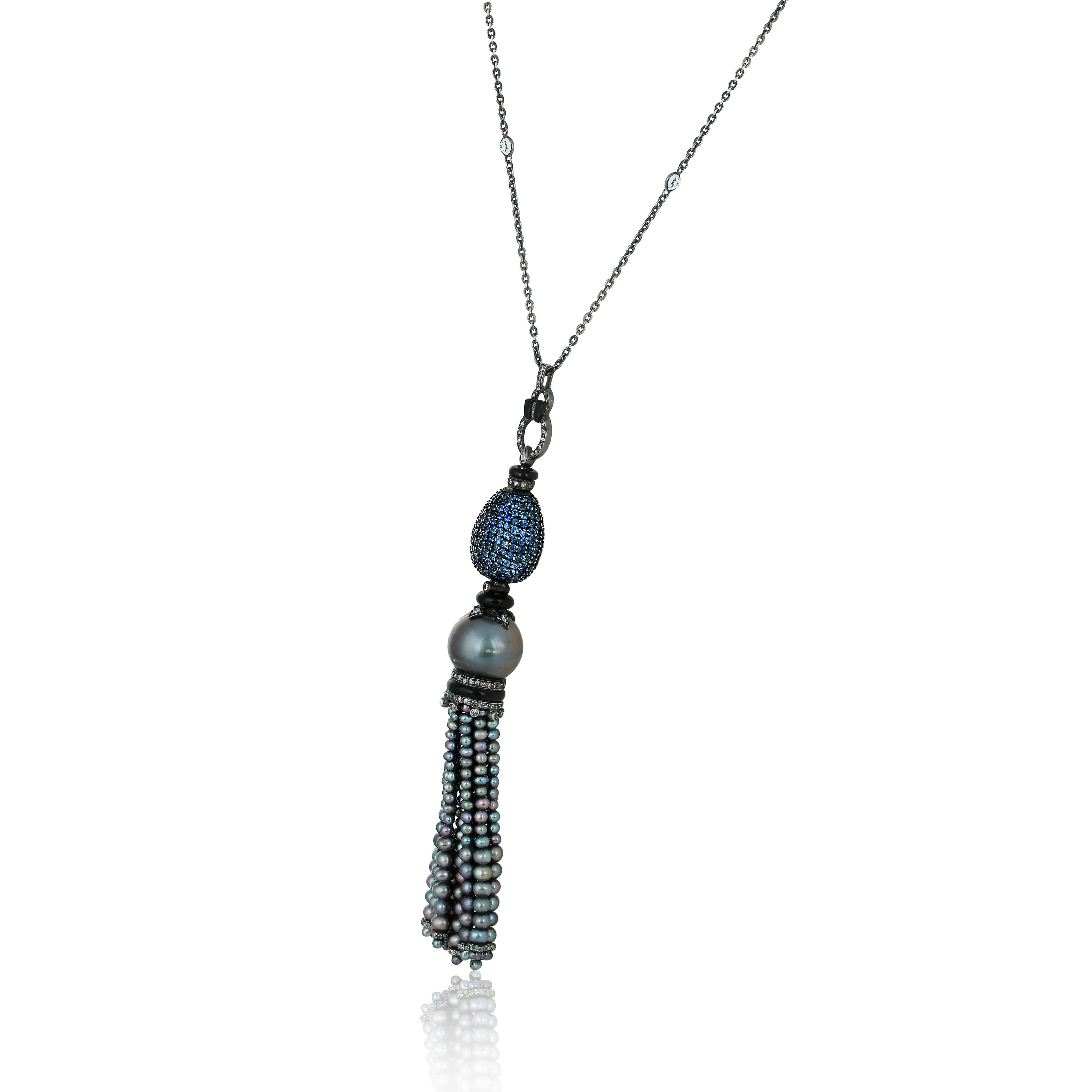 Introducing our 16Ct.T.W. Sapphire and Diamond Victorian Tassel Necklace with Pearls in 18k/925 - a piece that is sure to add a touch of luxury and elegance to any outfit. The tassel features a grey pearl  in between a sapphire lob at top and