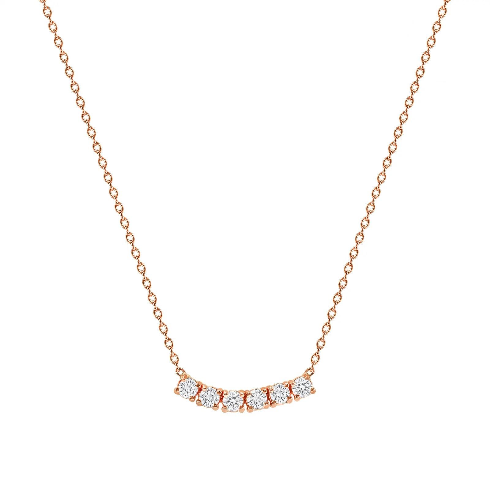 This petite, curved diamond necklace is crafted with gorgeous 14k gold set with six round diamonds.  

Gold: 14k 
Diamond Total Carats: 1.5 ct
Diamond Cut: Round (6 diamonds)
Diamond Clarity: VS
Diamond Color: F
Color: Rose Gold
Necklace Length: 16