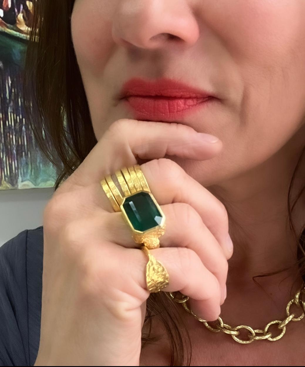 This GIA certified 16k emerald cocktail ring is a stunner! Bezel set east/west for a more modern twist in a bed of 22k gold. All handmade and hand carved complete with Tagili Designs signature finish. 

The Emerald is a heart stone because it