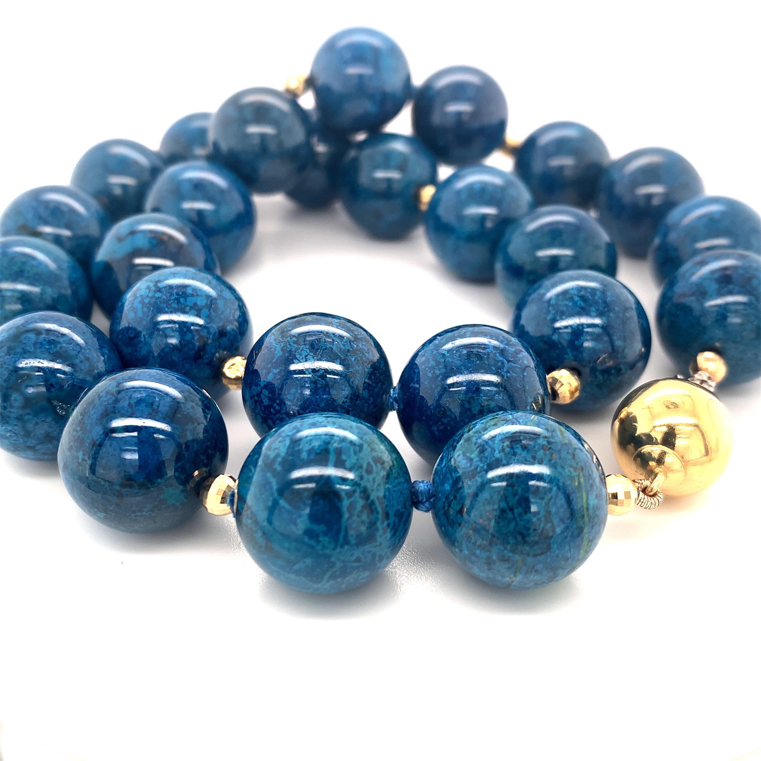 This impressive strand of 16mm round chrysocolla beads will put the finishing touch on any outfit! These beads have gorgeous color and variegated mottling displaying a beautiful combination rich cobalt blue, royal navy, and aqua tones. Shiny 14k