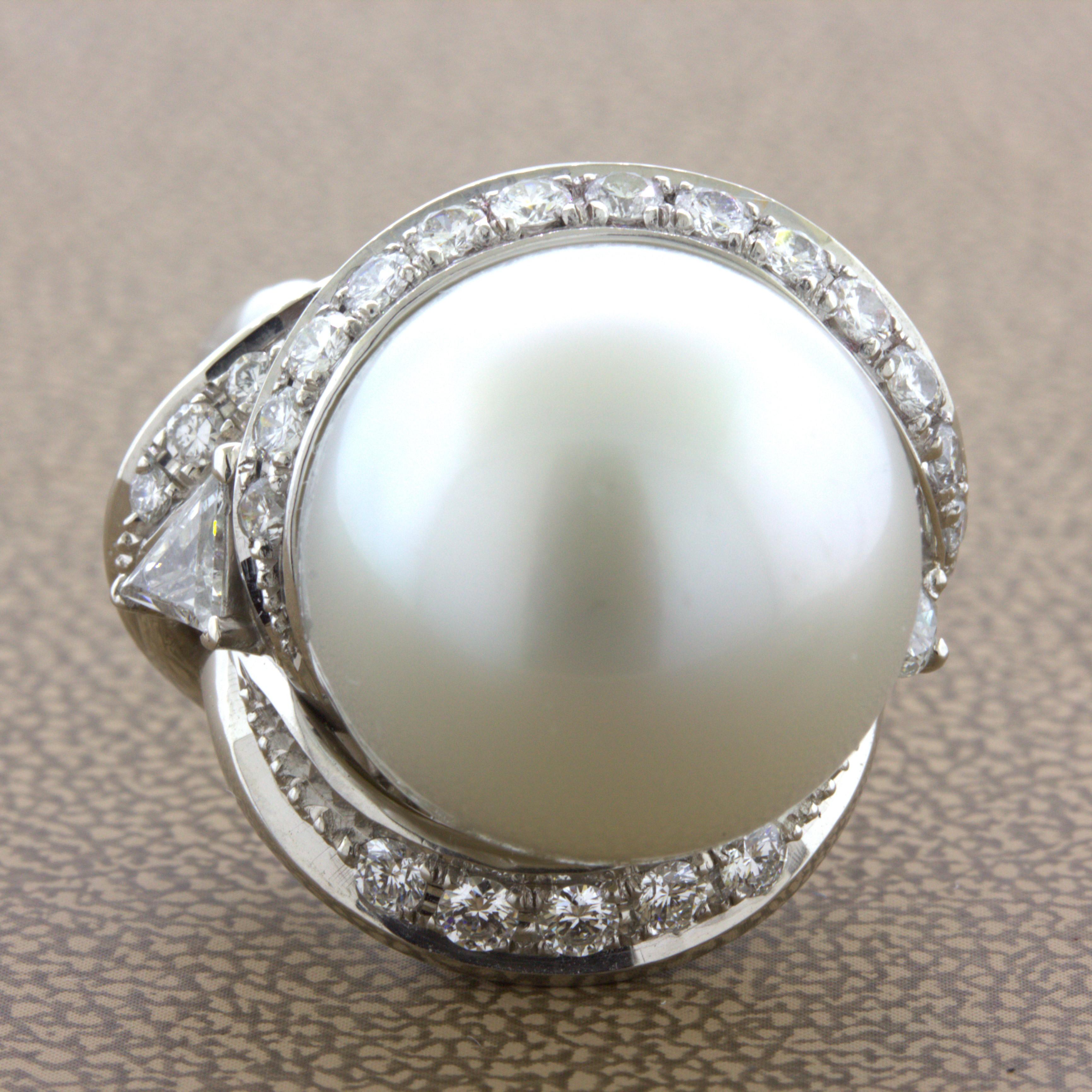 A large and beautiful ring featuring a fine south sea pearl measuring an impressive 16mm in diameter. Not only does it have a large size, but it is of top-quality. It glows in the light with a soft pink overtone due to its very strong luster and