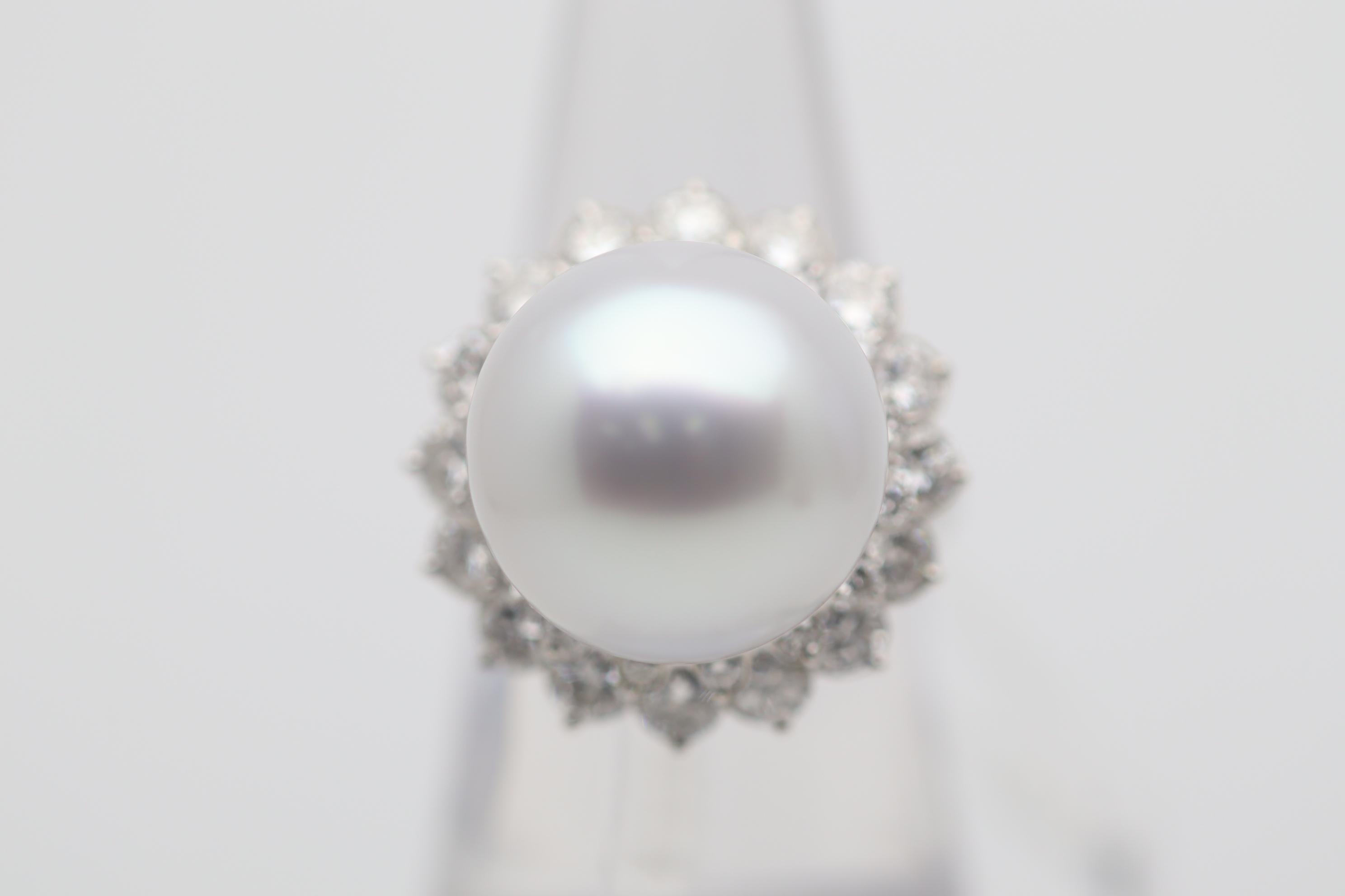 A large and impressive 16mm south sea cultured pearl takes center stage! Not only does it have a very large impressive size, but the quality is very fine as well. The pearl is perfectly round with great naker, strong luster, and a soft pink/gray