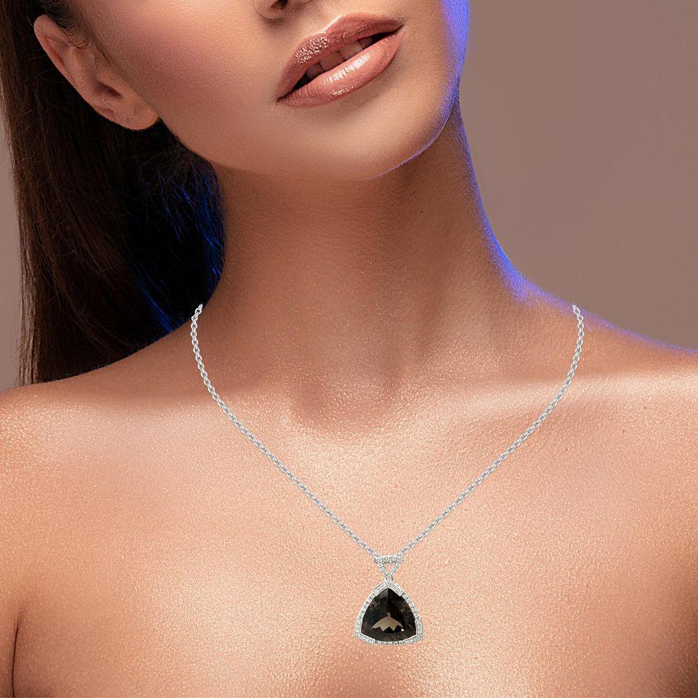 This stunning Trillion pendant has a top quality 16x16mm trillion top quality deep brown Smokey Topaz set in 14 karat white gold. There are 48 shimmering brilliant cut diamonds all round the stone for a delicate accent. This pendant comes in a